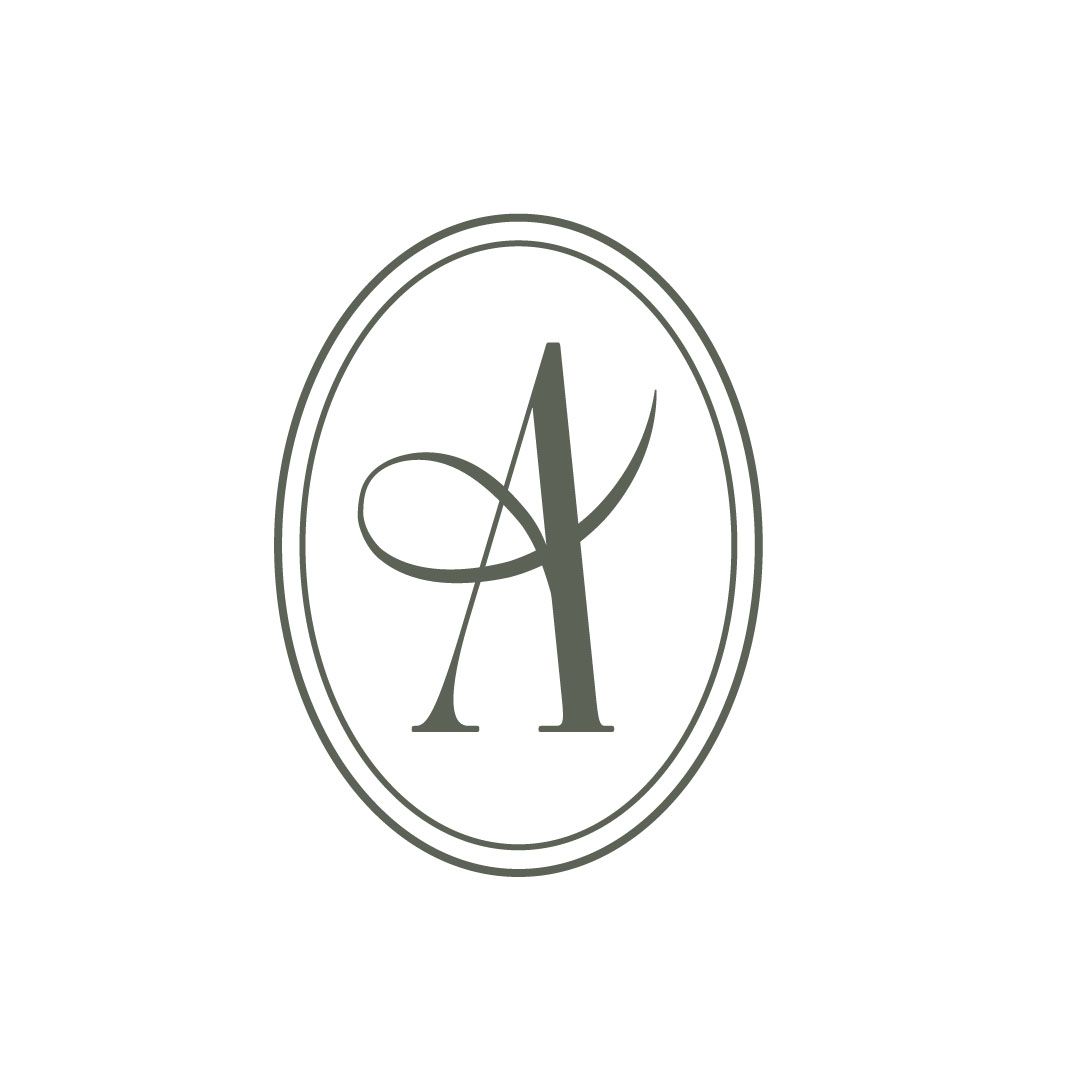 Minimalist oval logo design with decorative letter A in gray.