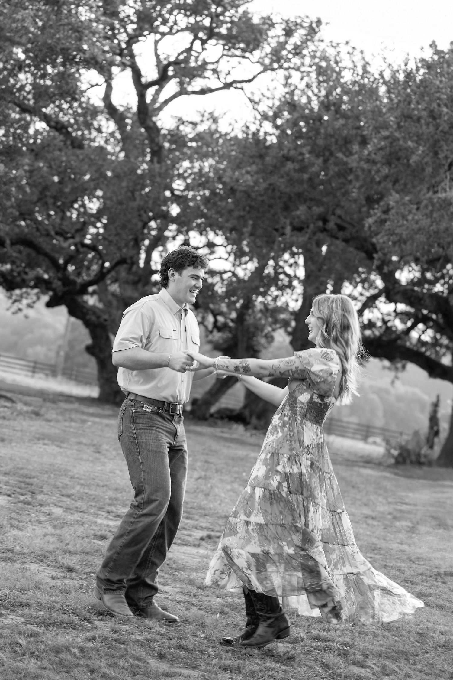 Black and white photo sequence showing a couple dancing together on a grassy hillside under trees.