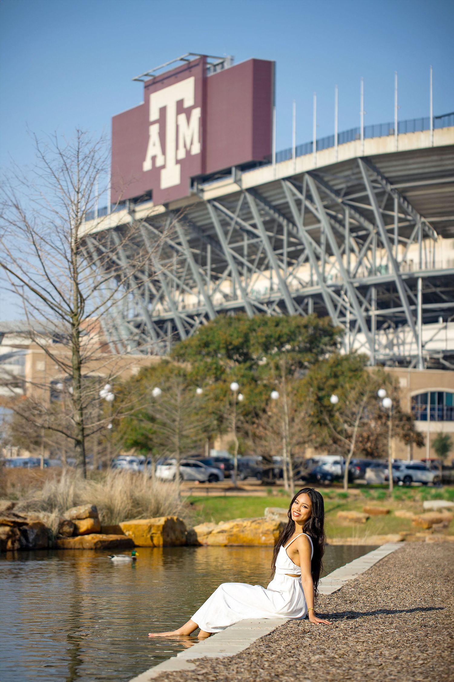A scenic photo series showing Kyle Field stadium at Texas A&M University with a pond in the foreground.