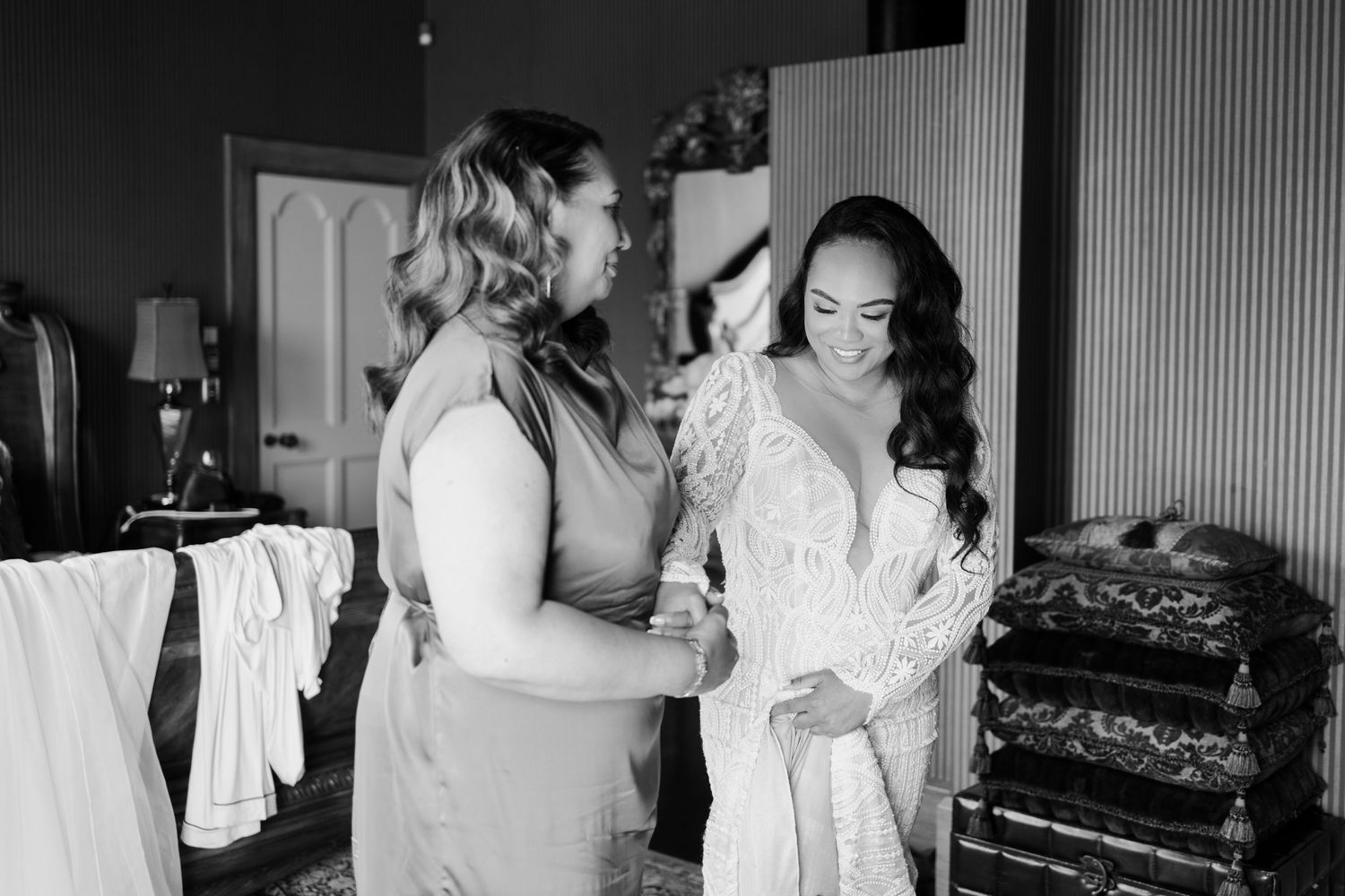 A black and white collage of wedding preparation moments showing dress adjustments and candid interactions.