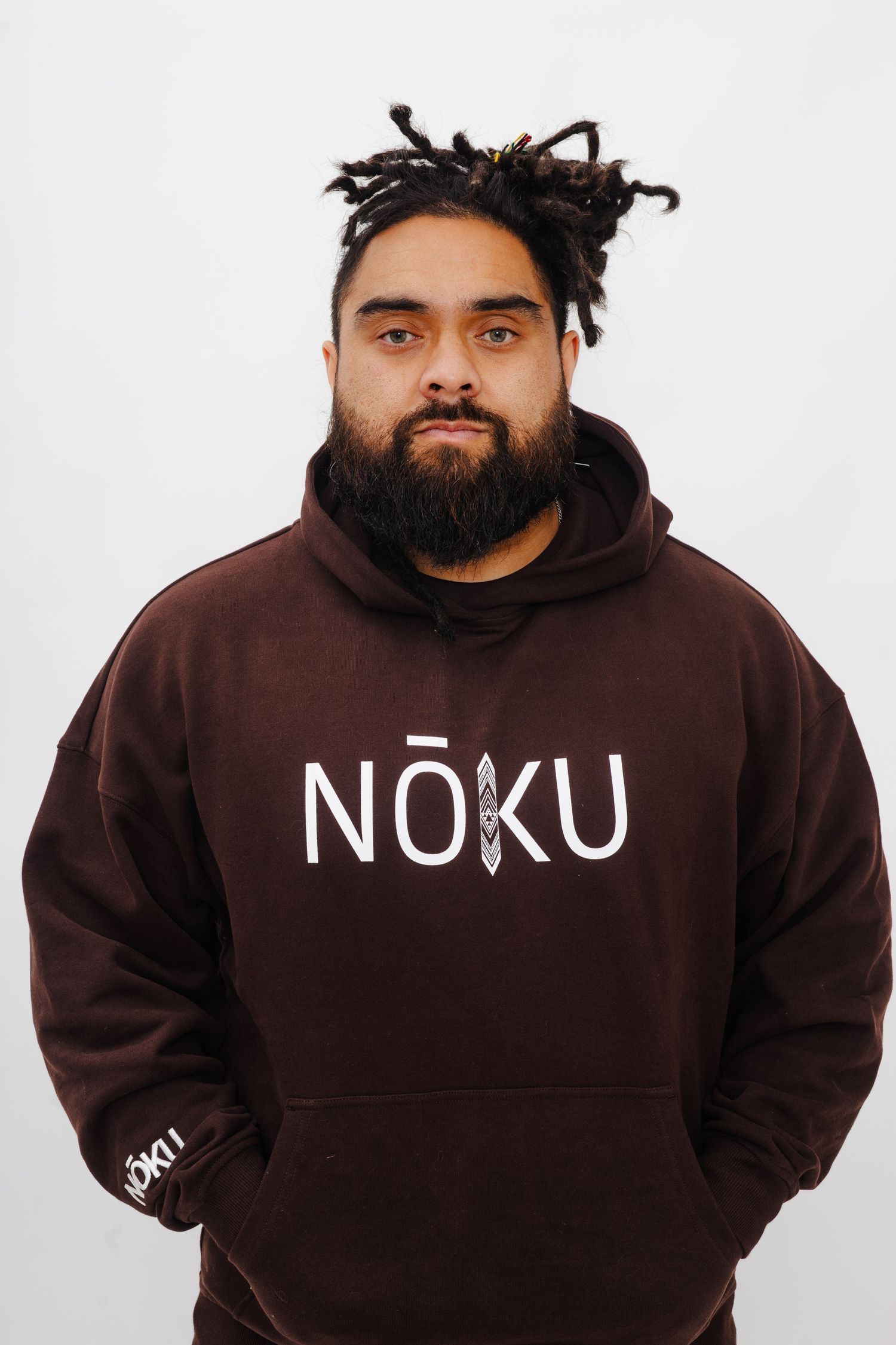 Brown hoodie sweatshirt with NOKU text logo shown from multiple angles against white background.
