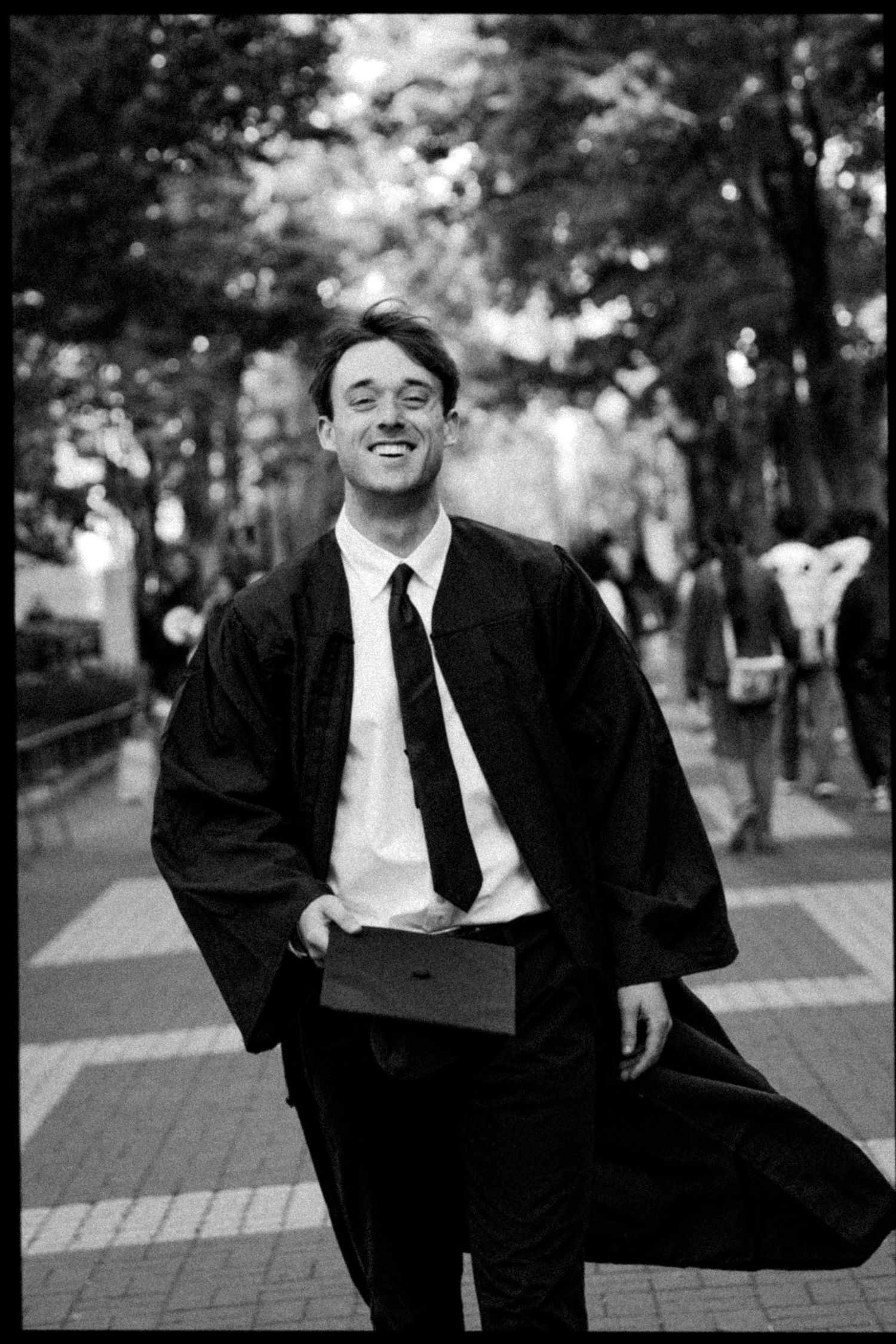 Black and white series of candid moments in formal attire on brick walkway.
