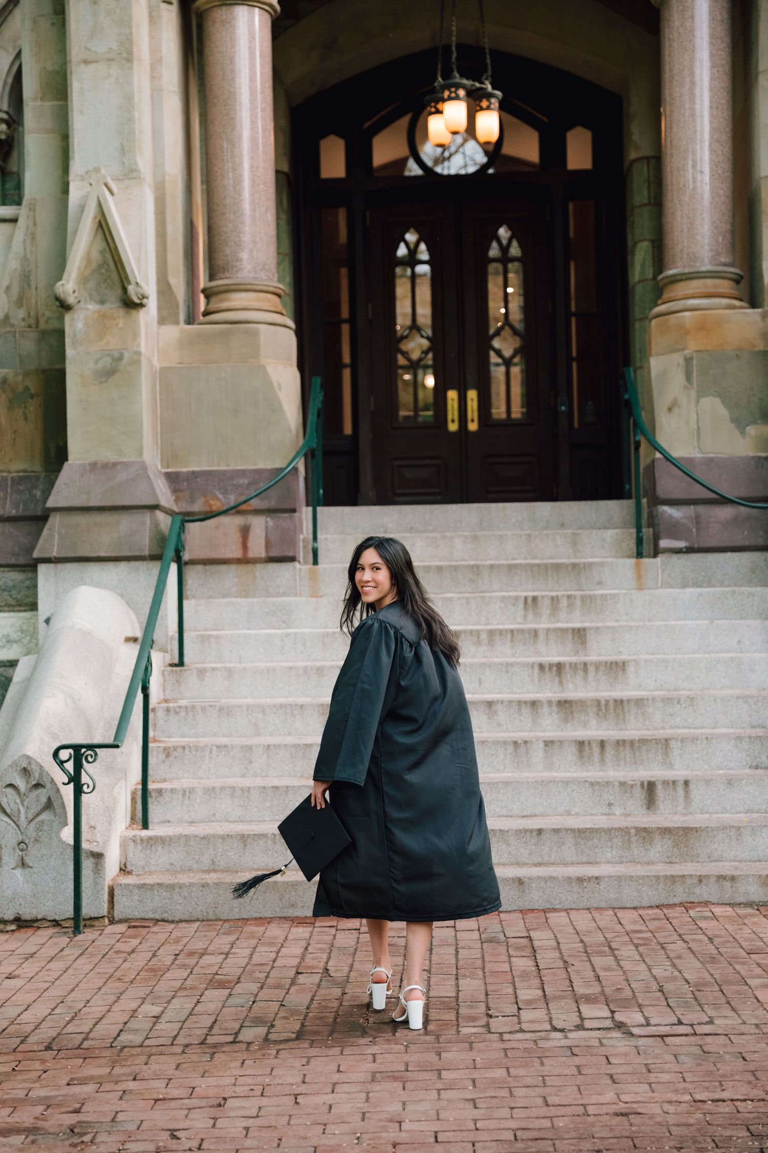 Series of photos showing graduation celebration dance moves on stone steps of a historic building.