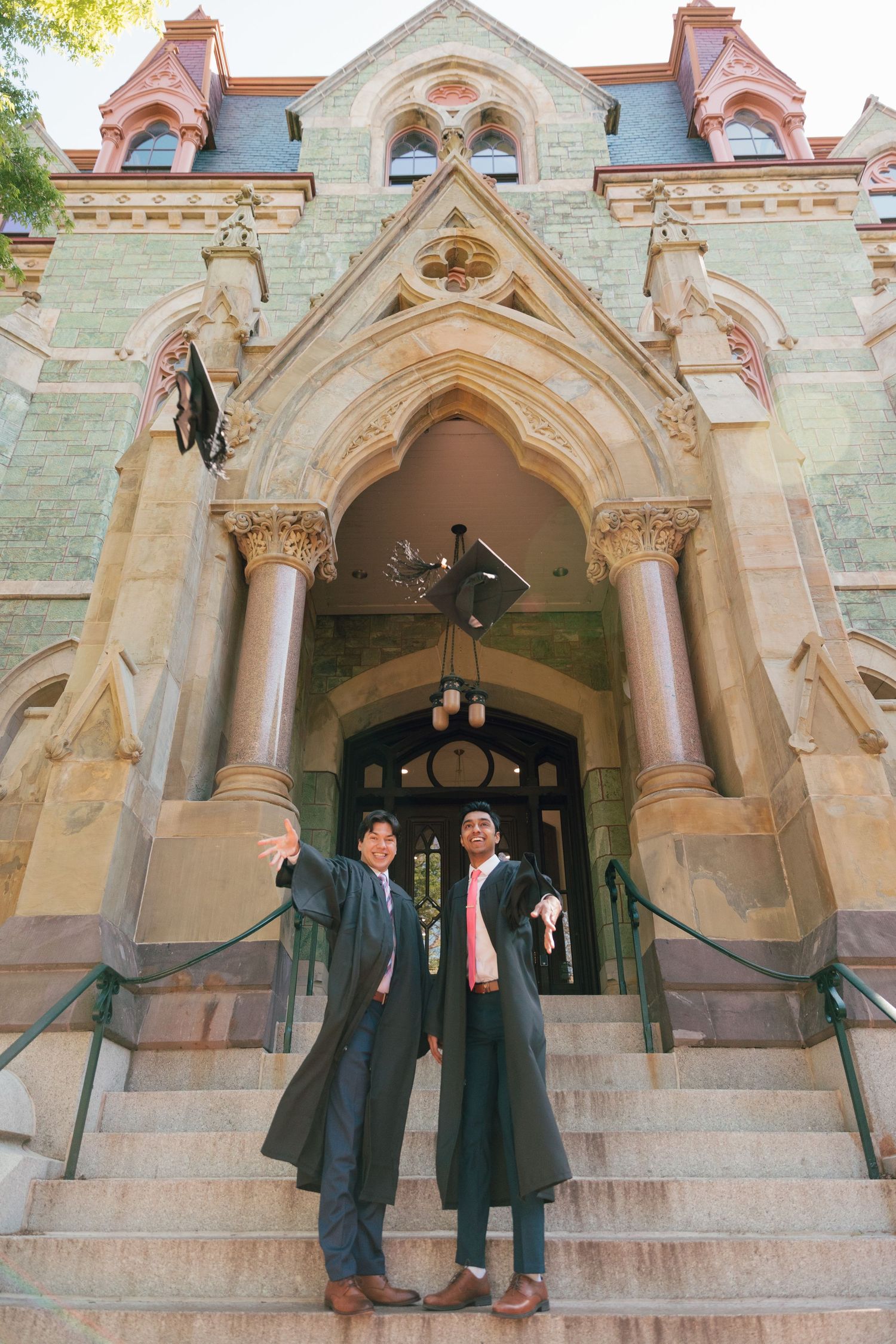 Gothic architecture graduation photos on stone church steps.