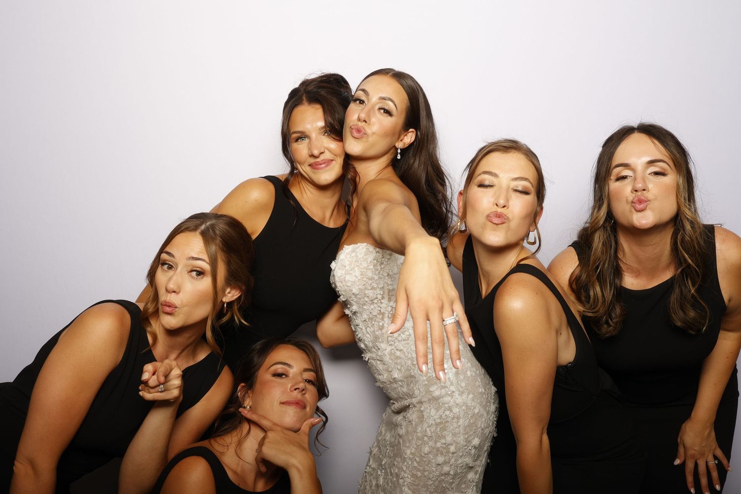 Friends posing playfully in multiple photo booth style shots with white background.