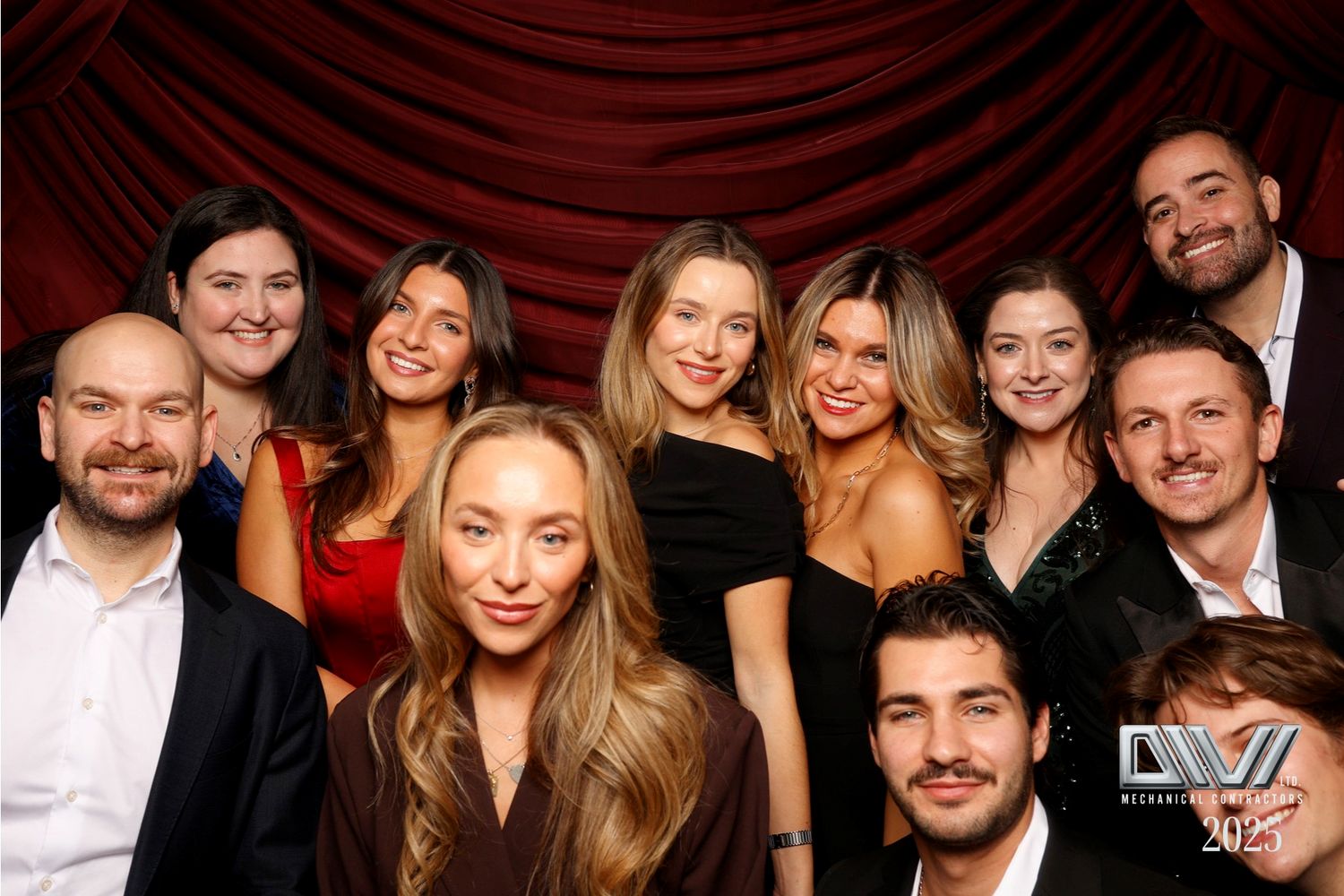 Group of friends smiling and posing together at a social gathering.
