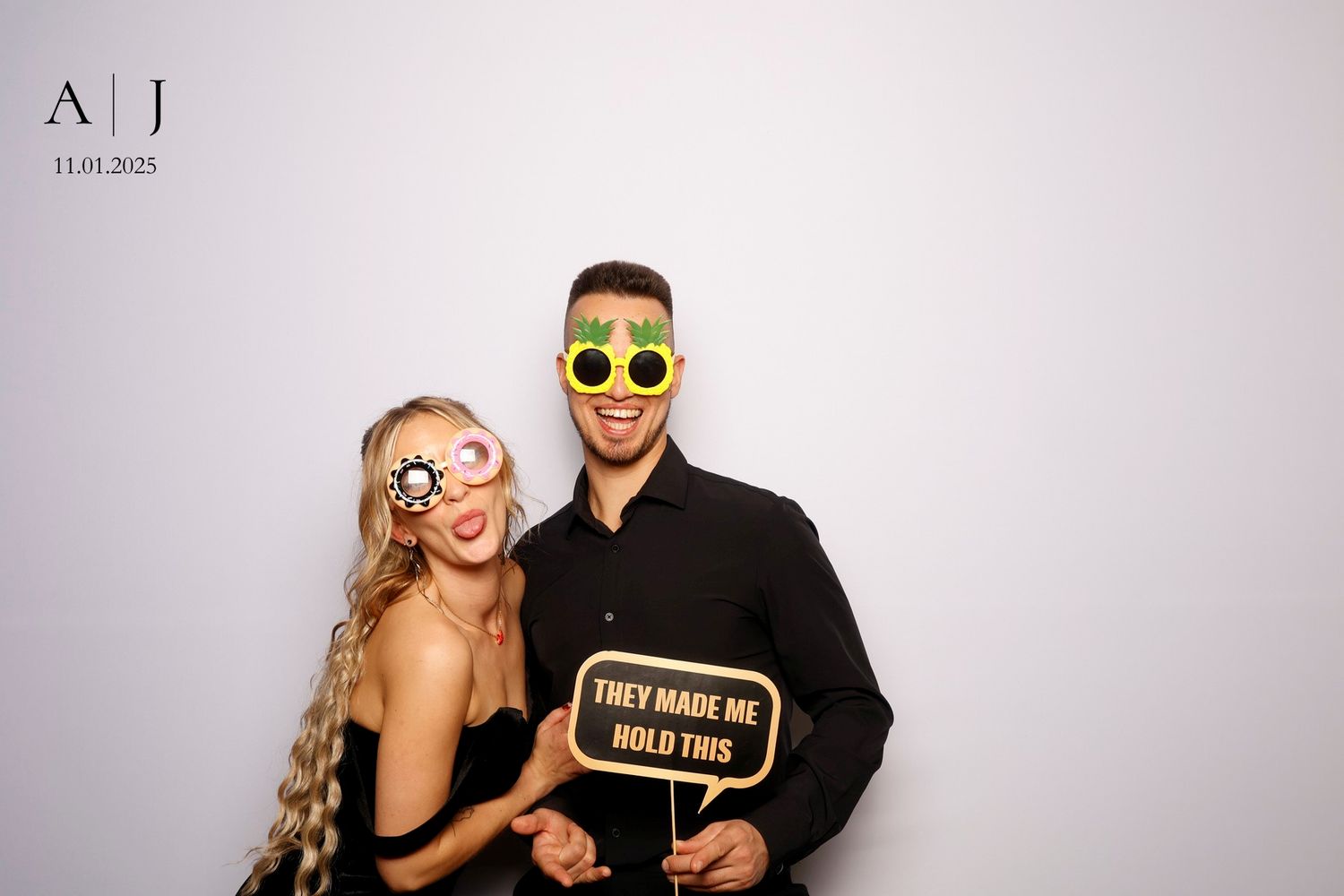 A series of black and white photo booth style snapshots showing a couple posing playfully together.