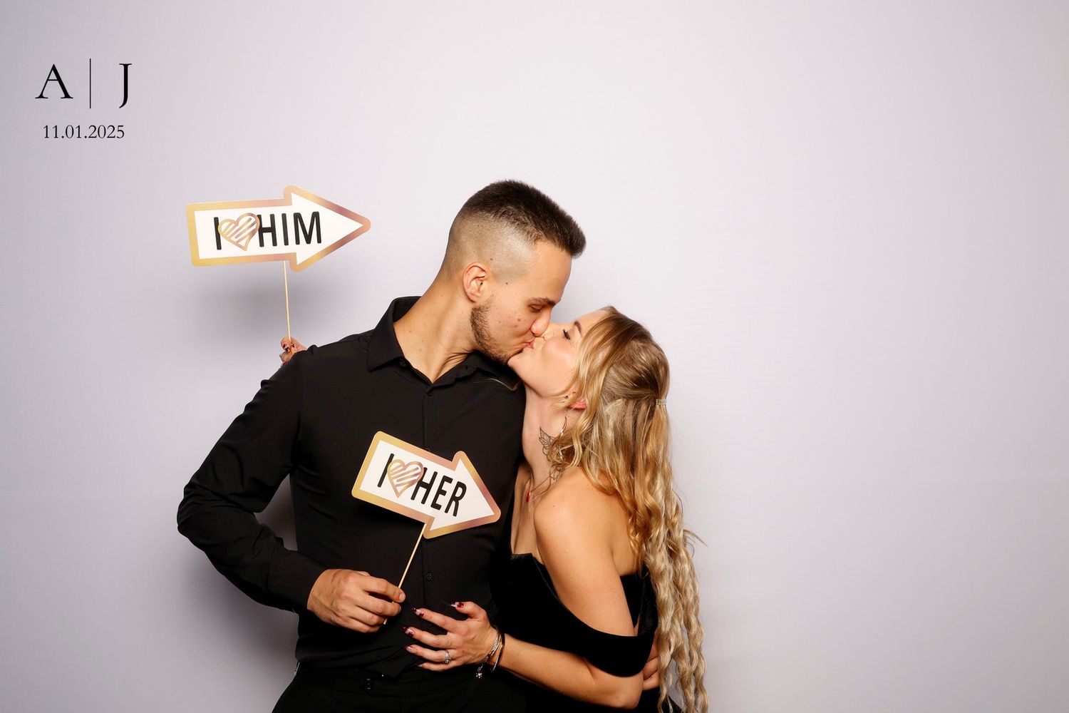 A couple in black attire share romantic moments across a series of intimate black and white photographs.