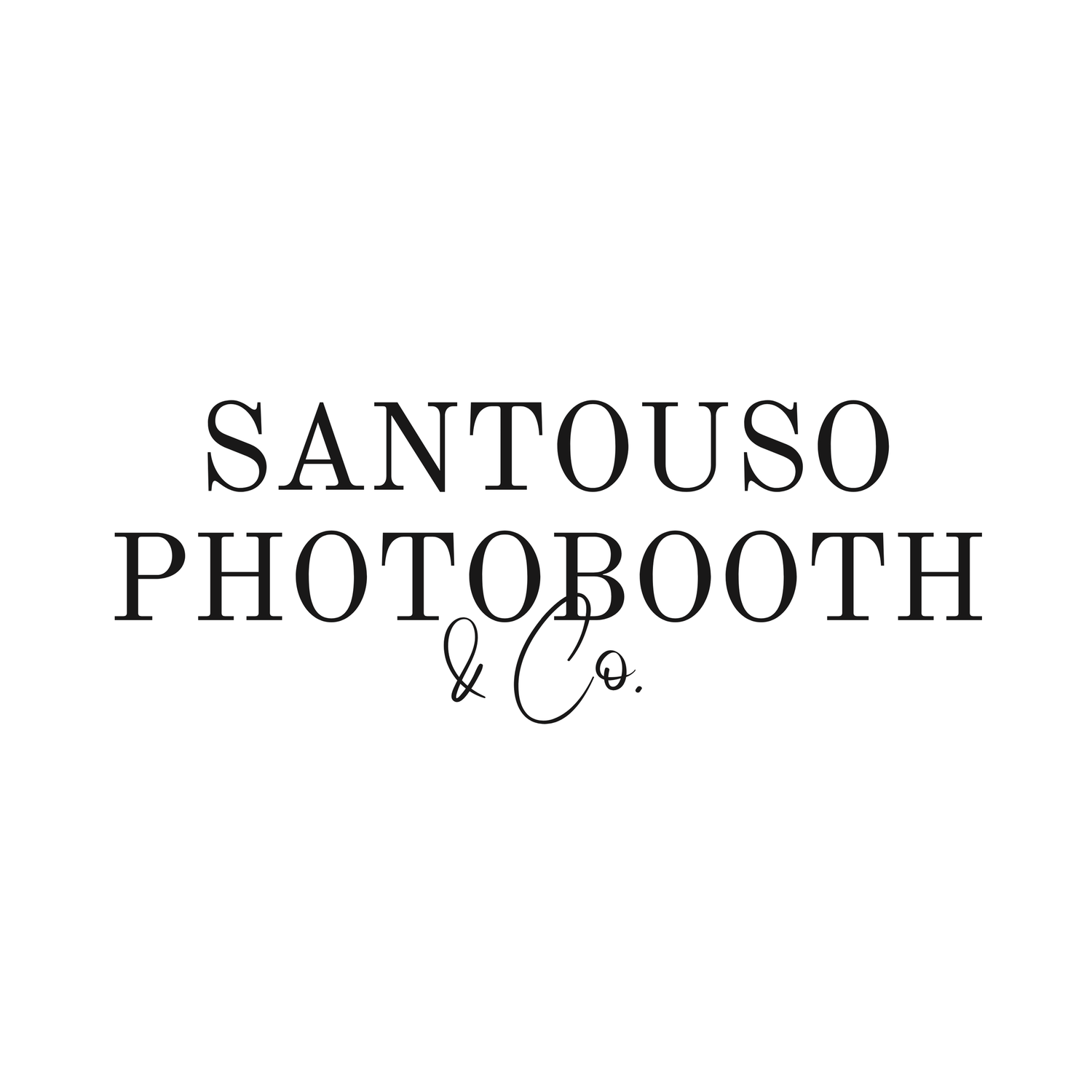 A vintage-style photobooth sign in black text against a light background.