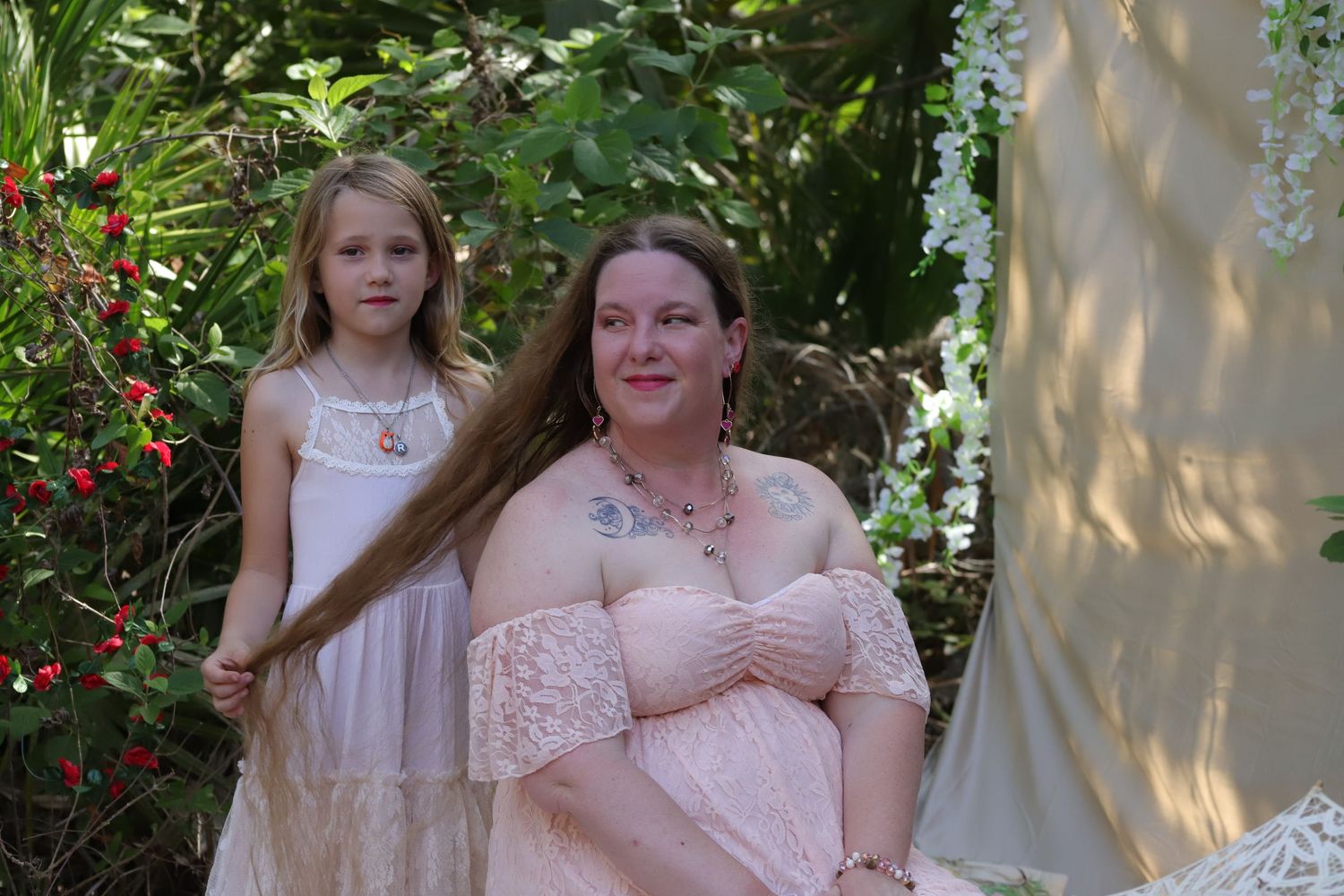 Mother and daughter sharing a loving moment during a Mother’s Day portrait session captured by Captured Moments Photography in Southwest Flo