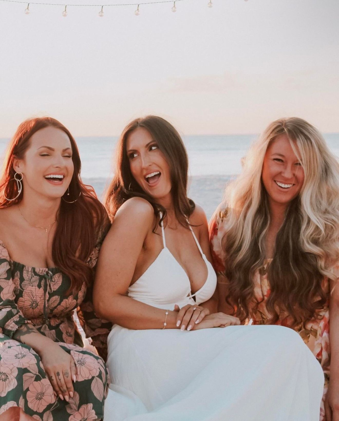 Bride-to-be enjoying a romantic picnic on the beach, capturing a joyful bridal moment during a coastal celebration in Southwest Florida.