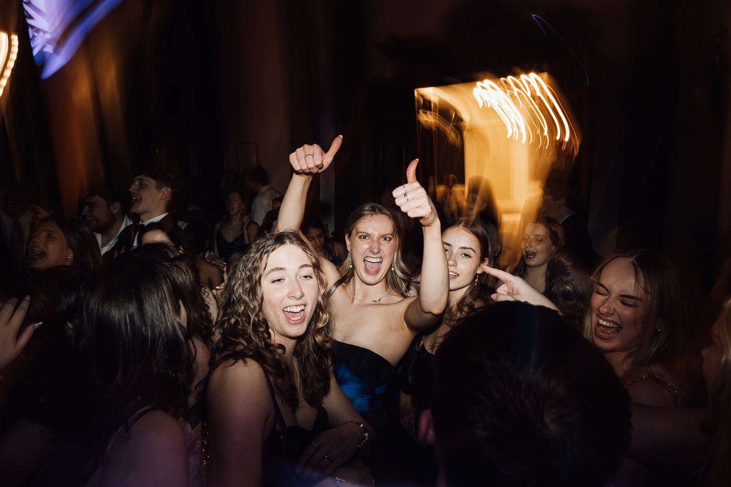 Silhouetted dancers enjoying a lively party atmosphere.