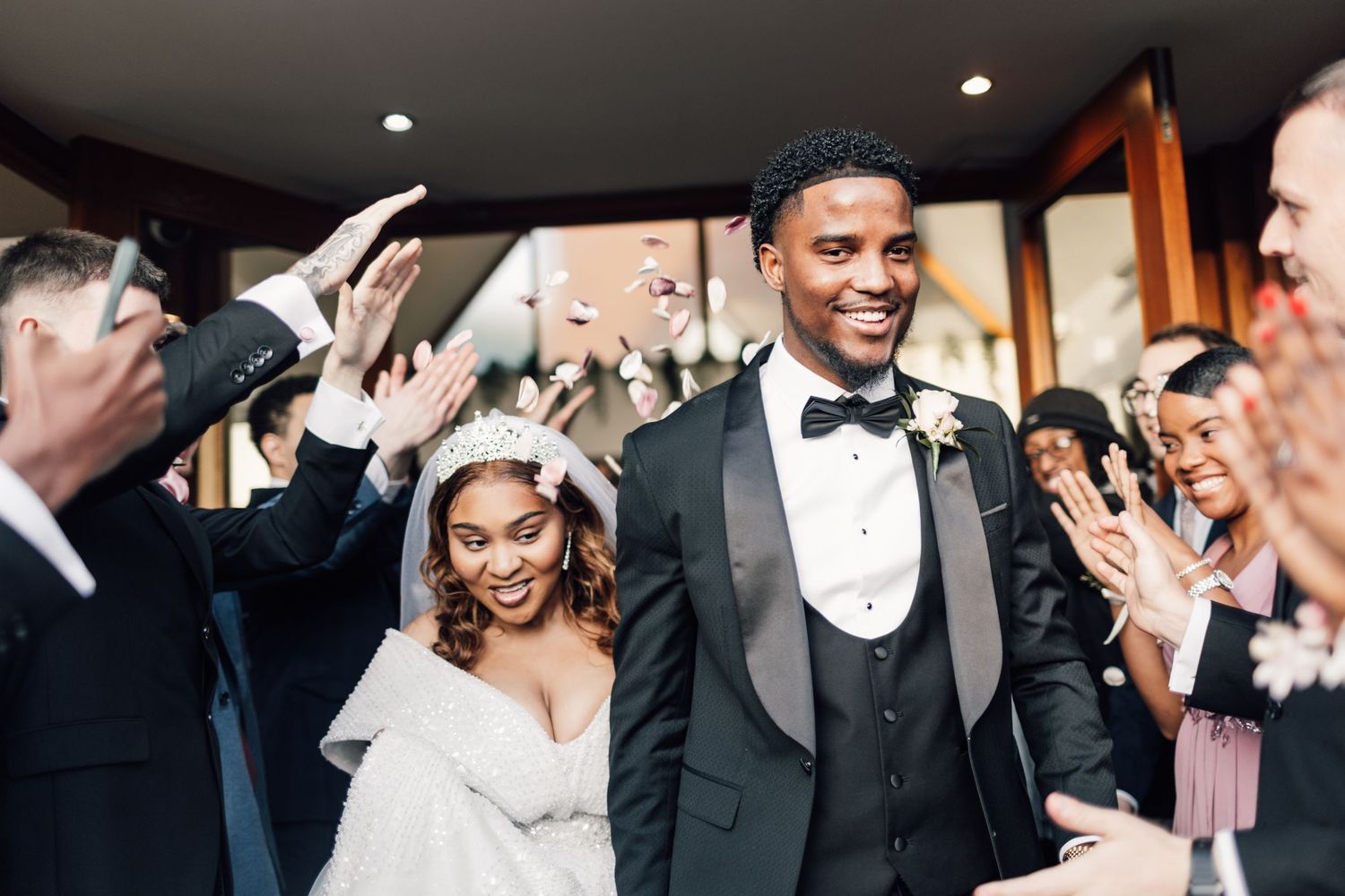 Elegant wedding reception moments captured with the couple and guests celebrating.