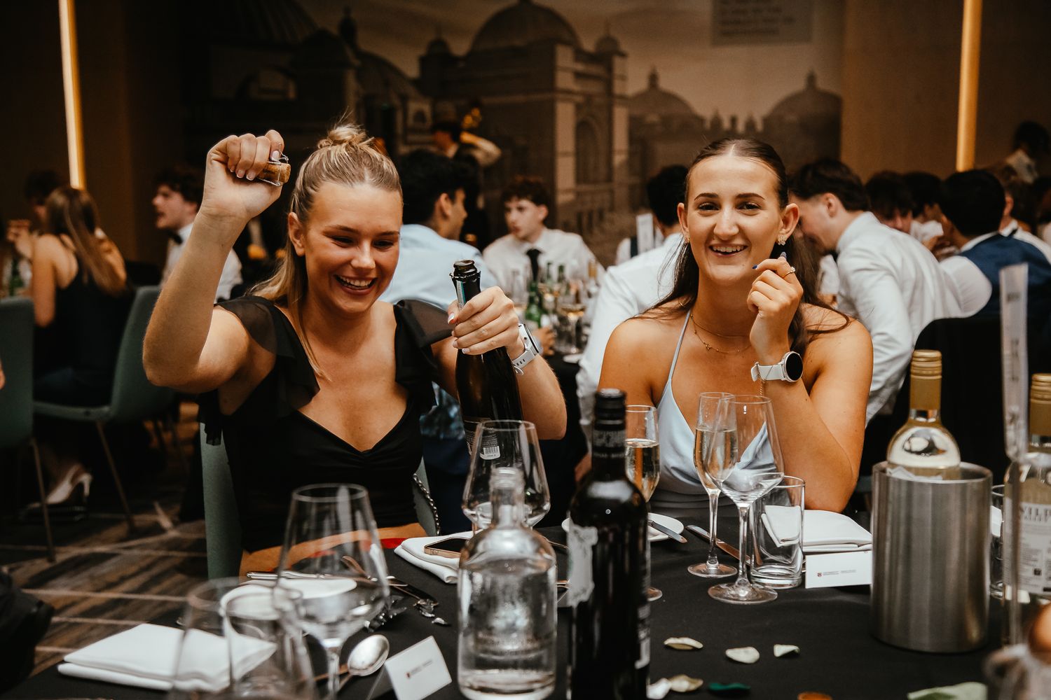 Guests mingling and socializing at an elegant dinner reception event.