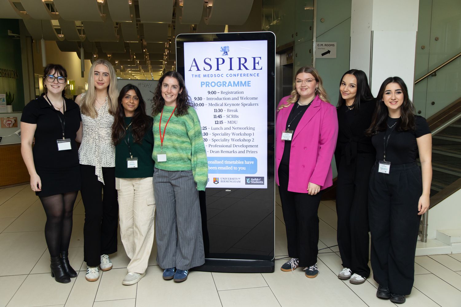 Group photo of participants standing together at a professional conference event.