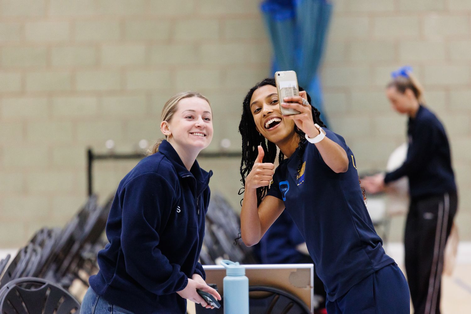 Athletes taking a break and socializing during a sports event.