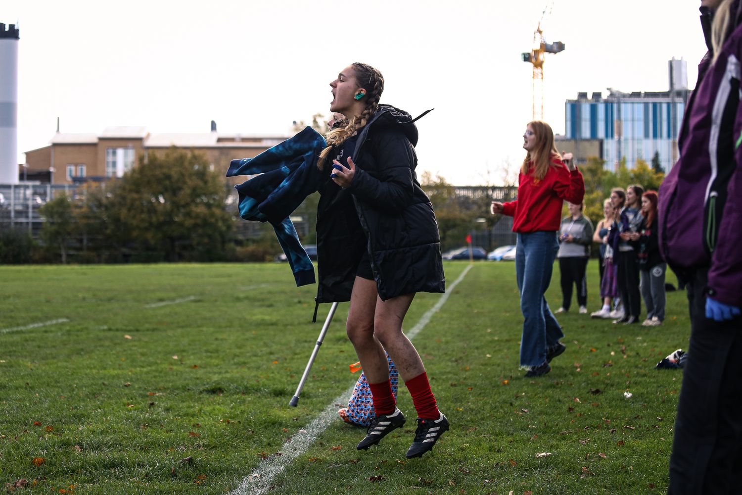 Athletes warming up on a field before a sports competition.