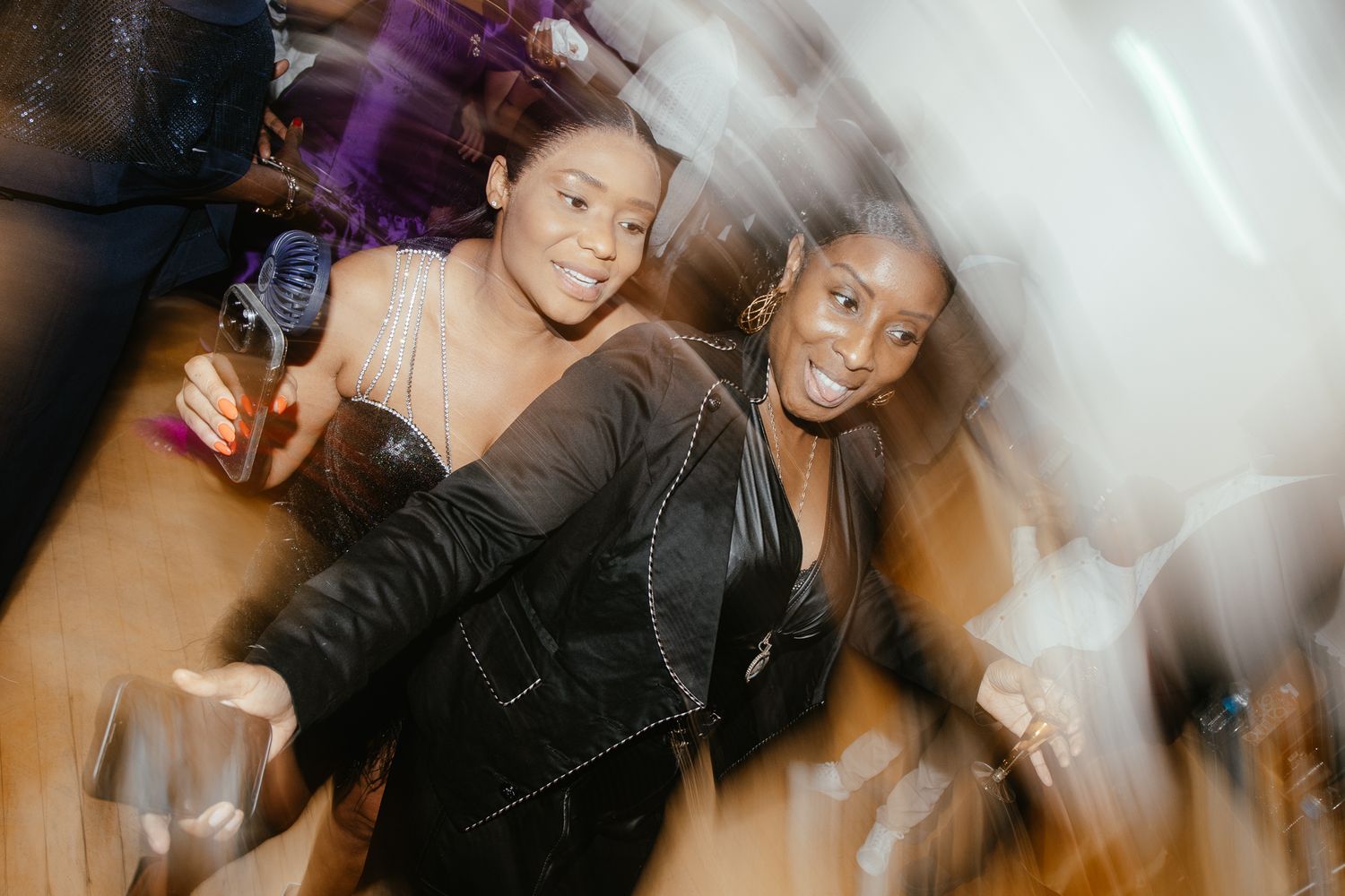 Dynamic party scene with motion-blurred dancers enjoying celebration.