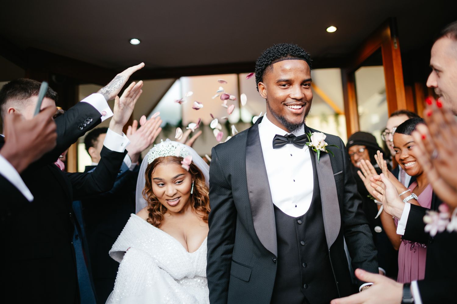 Wedding party guests enjoying themselves during a lively reception celebration.