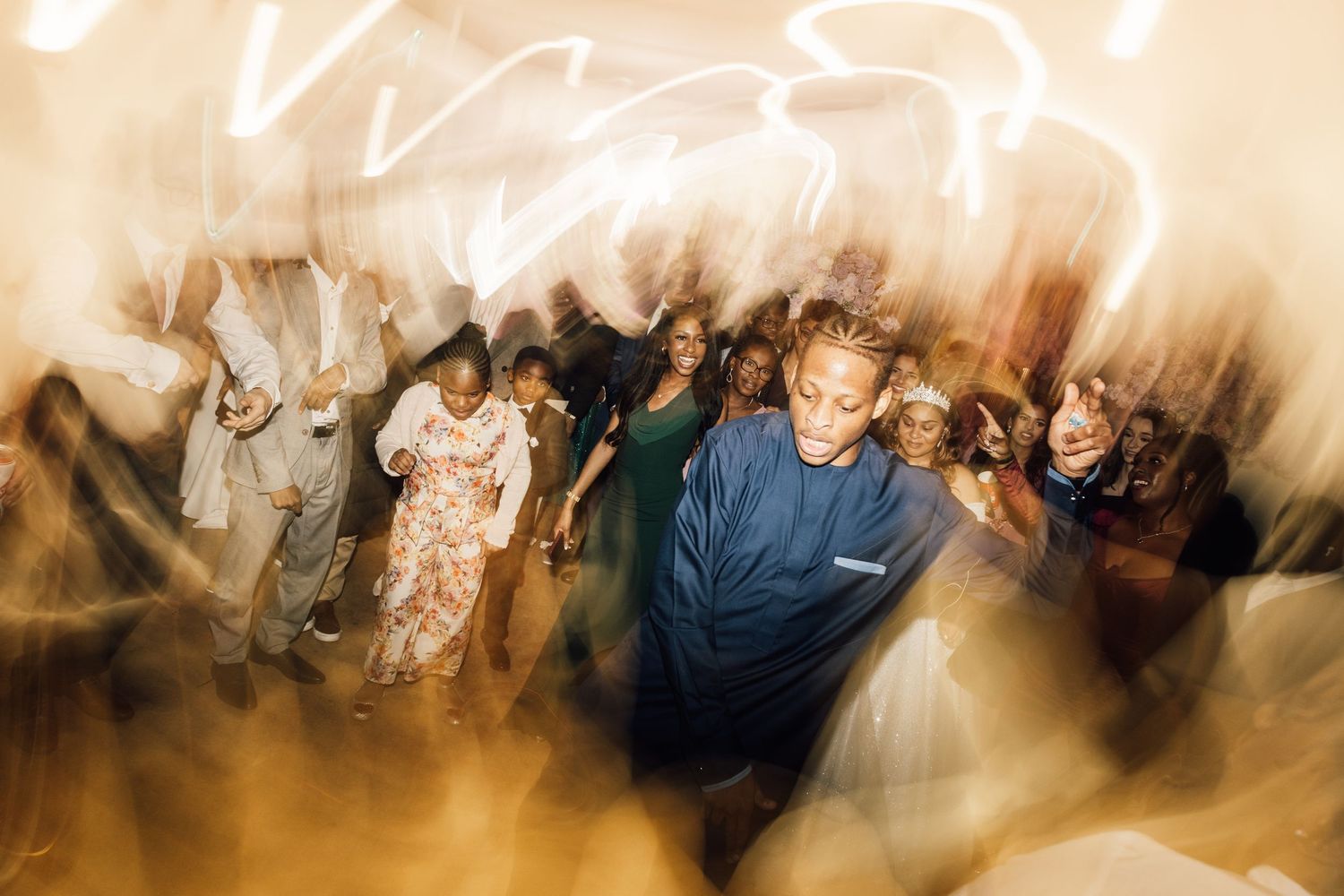 Artistic motion blur shots of wedding reception dance floor celebration.