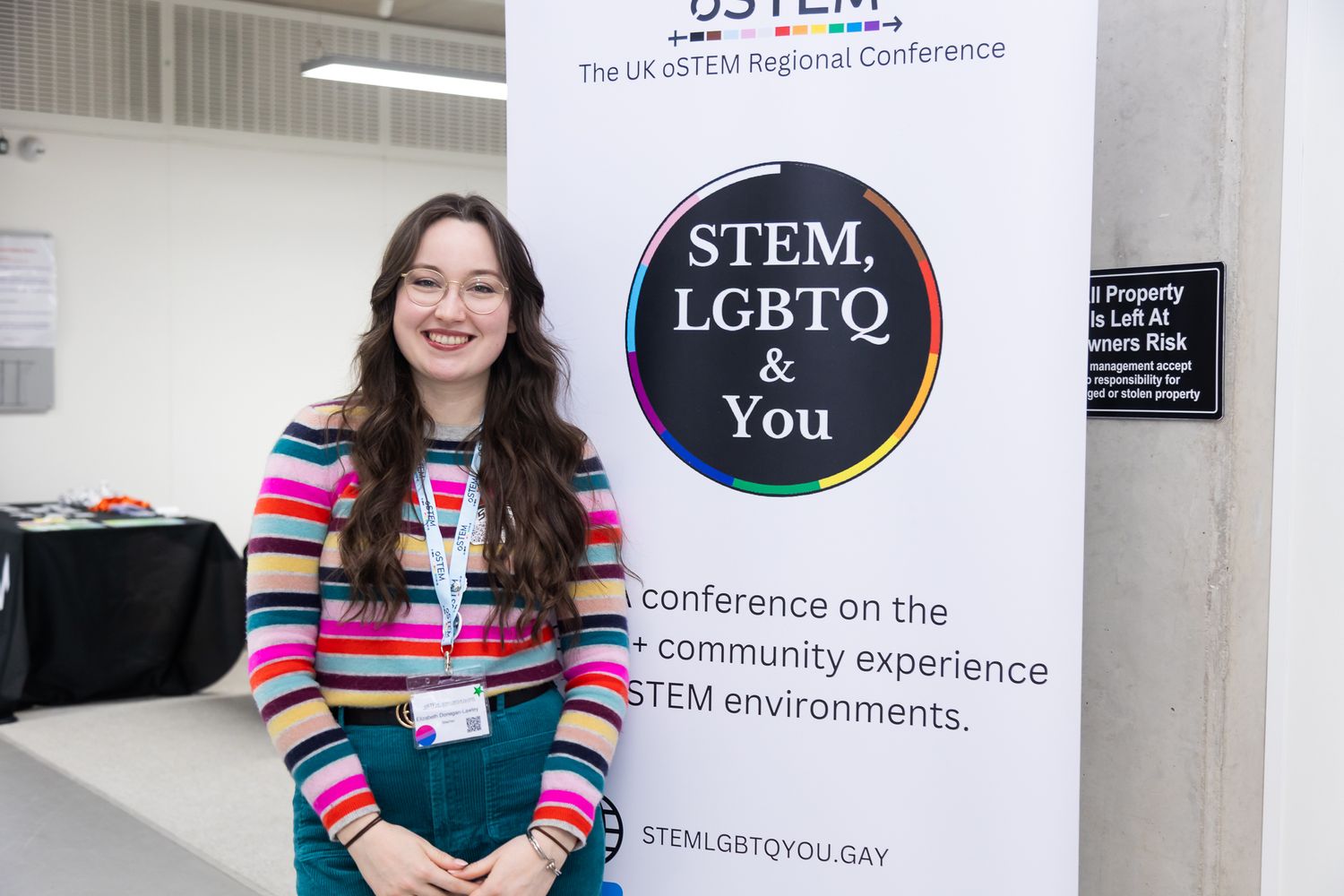 Conference signage and branding displays showcasing LGBTQ STEM initiatives.