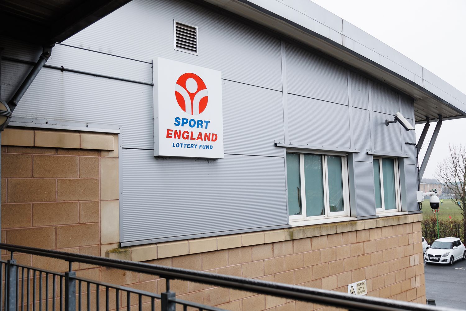 Exterior view of a modern sports facility with England Sport branding.