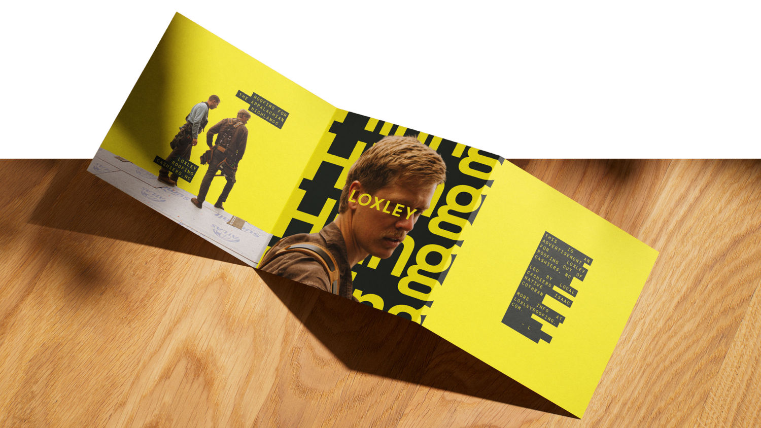 Open yellow tri-fold brochure on a wooden table with black typography, a young man's portrait and a smaller photo of two people.
