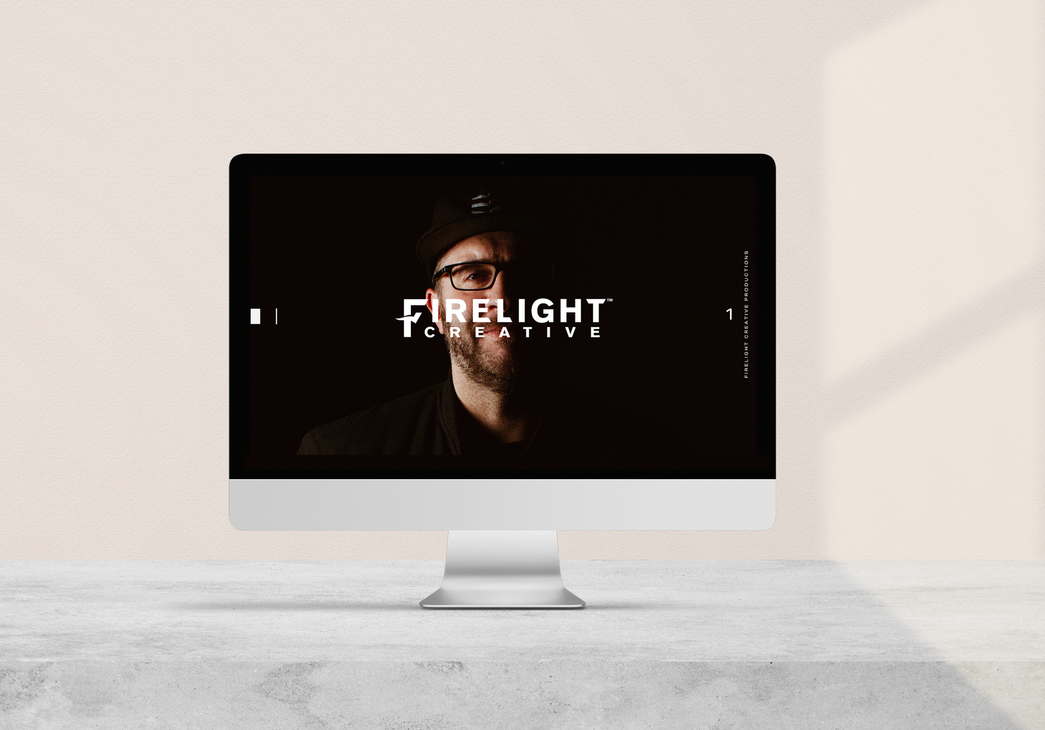 Desktop computer displaying Firelight brand logo on dark minimalist screen.