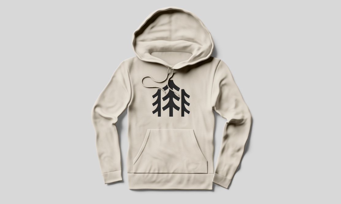 Light beige hoodie with minimalist pine tree logo design on the front.