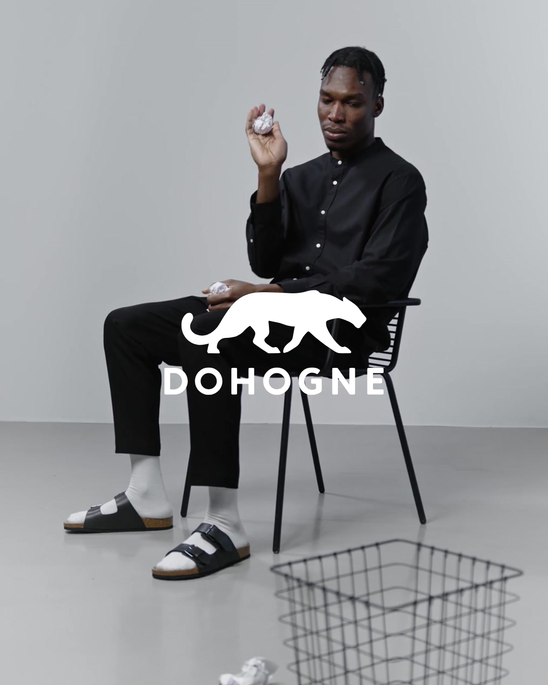 Dohogne brand photo featuring modern minimalist menswear and African-American model in studio setting