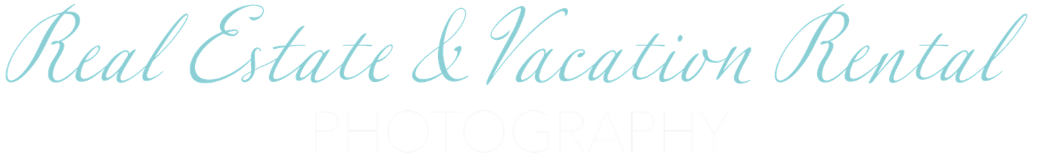 Elegant cursive text reading Real Estate and Vacation Rental in light blue script on a white background.