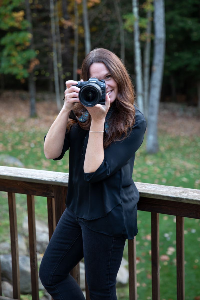 Photo of the photographer holding a camera.