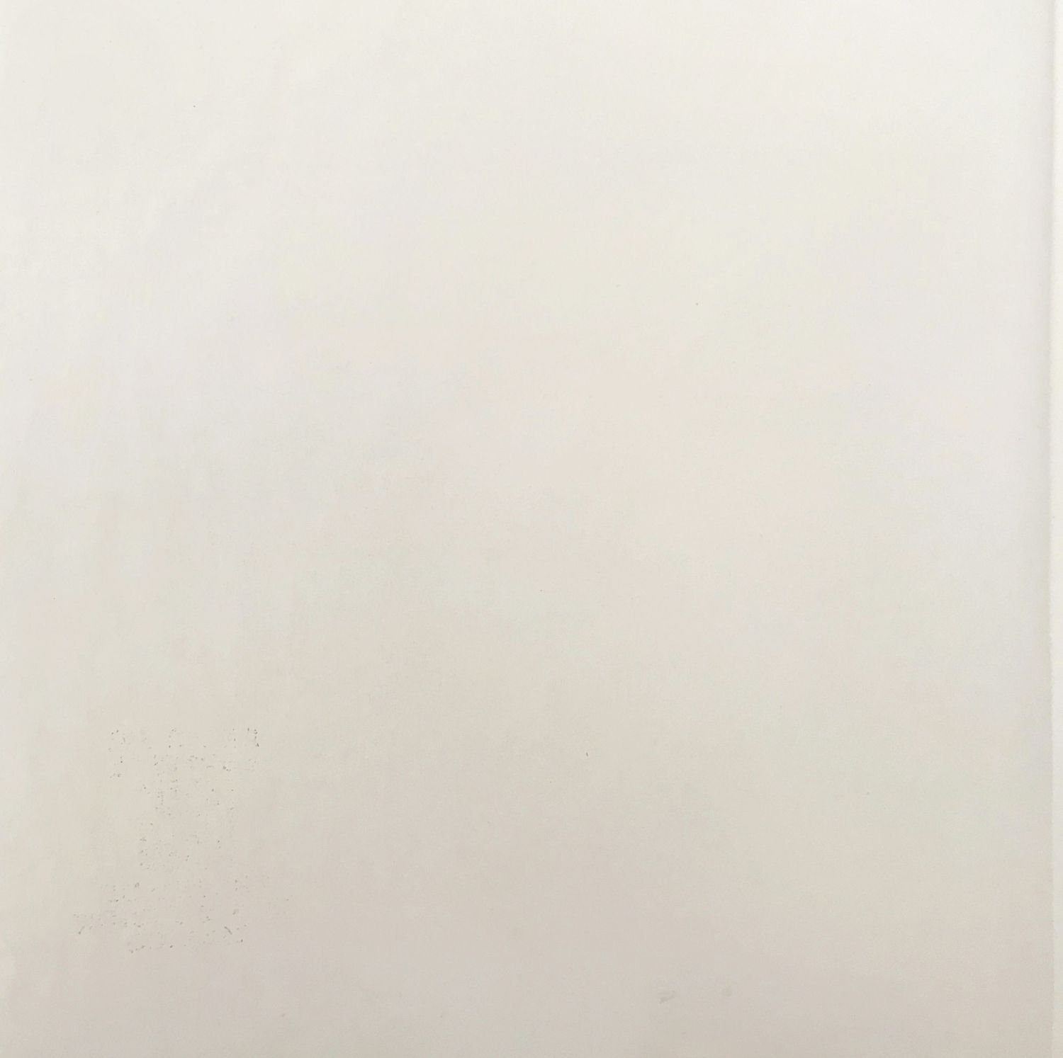 Plain white ceramic floor tile with a smooth, matte finish and subtle texture variations.