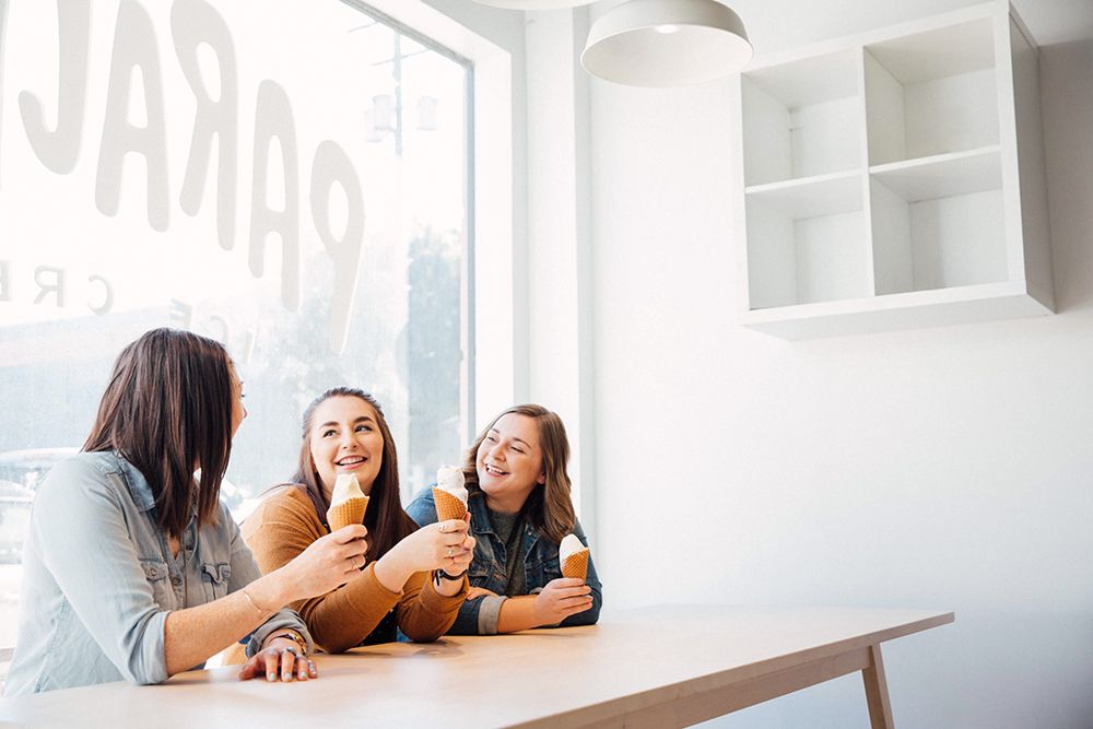 Three woman having Ice Cream at Victoria's Parachute Ice Cream Parlour