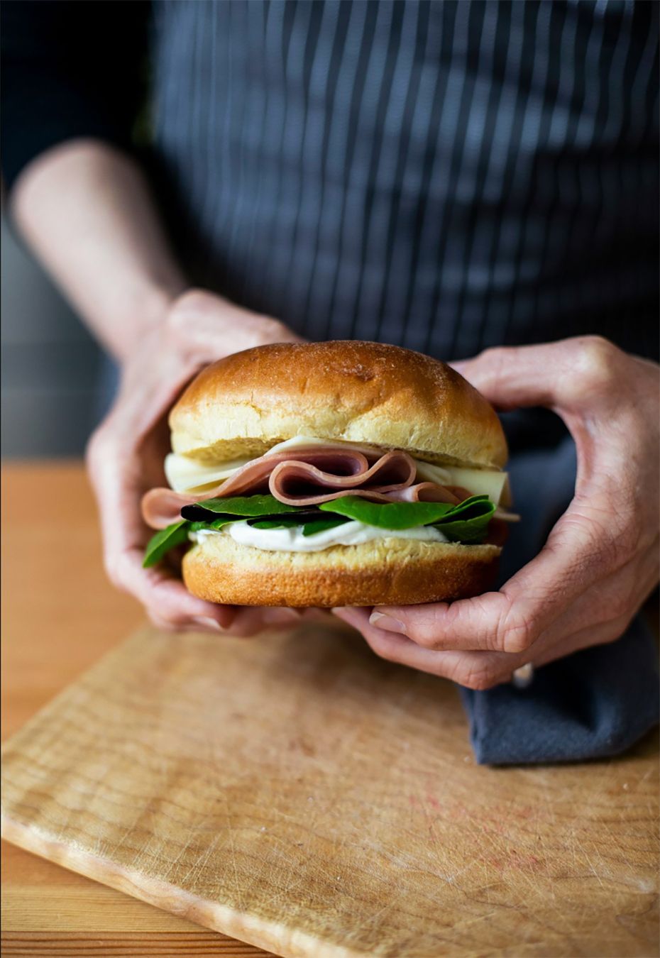 Chef holding a sandwich
