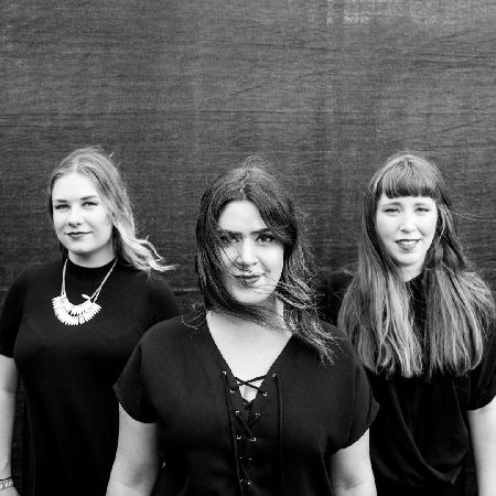 black and white gif of three woman with wind blowing in the wind