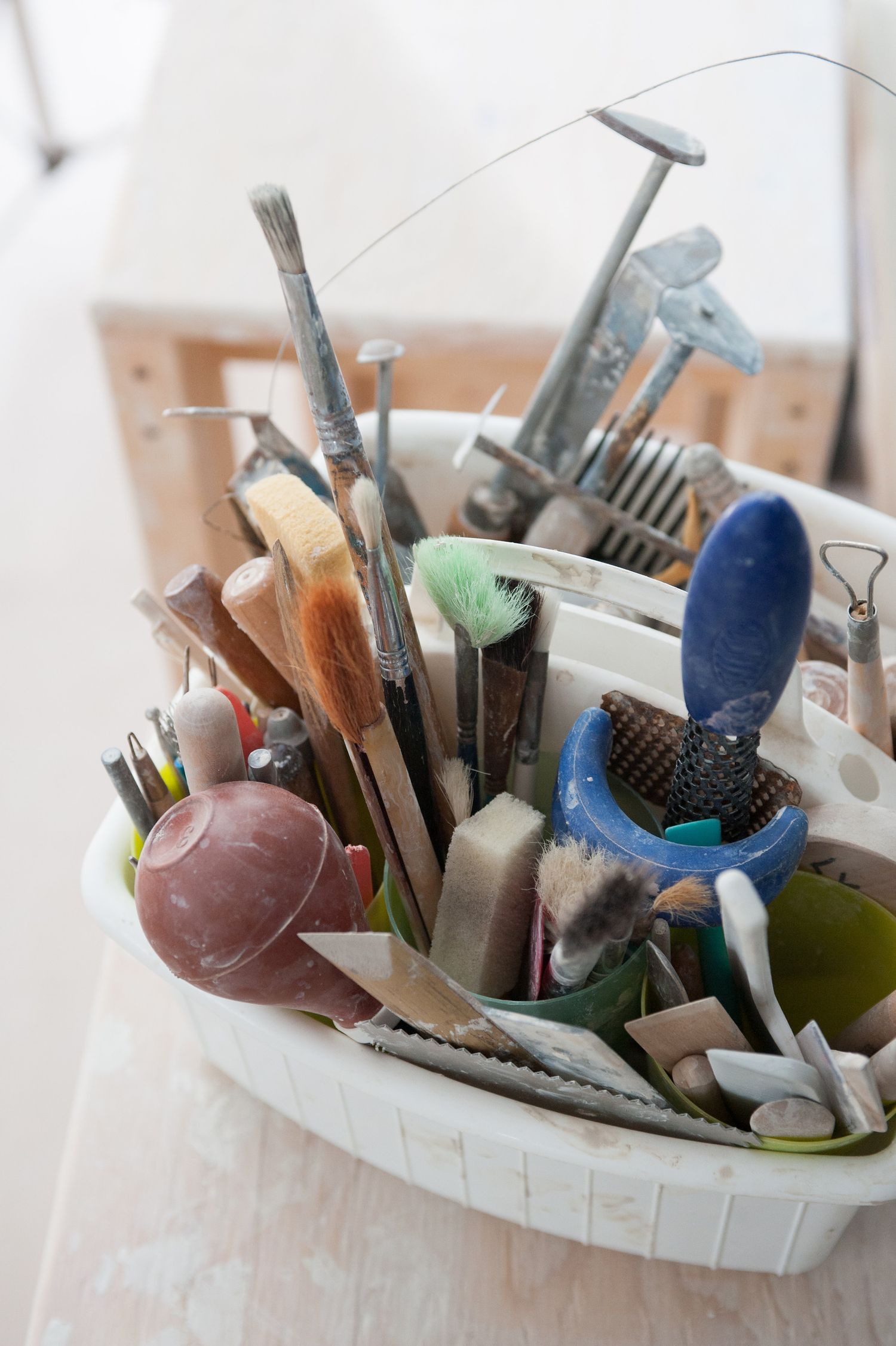 Tools in a caddy in a artists studio