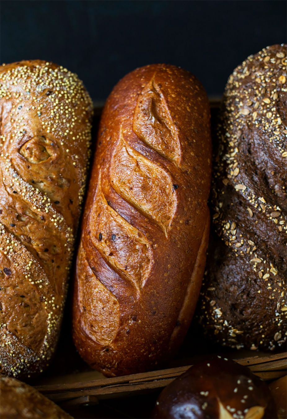Three rustic loaves of bread produced by Portofino Bakery In Victoria BC