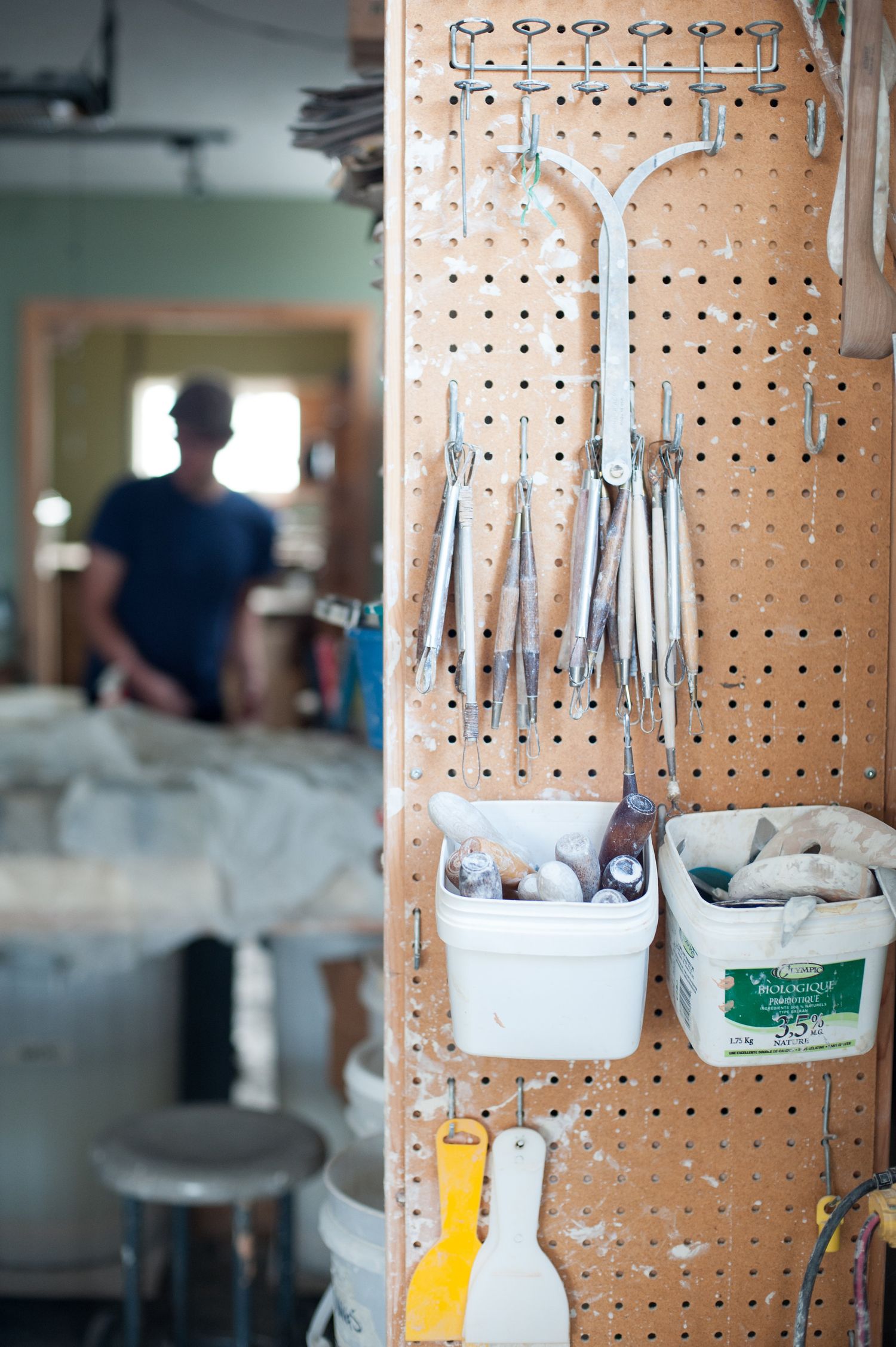 Tools hanging on a wall in a ceramics studio