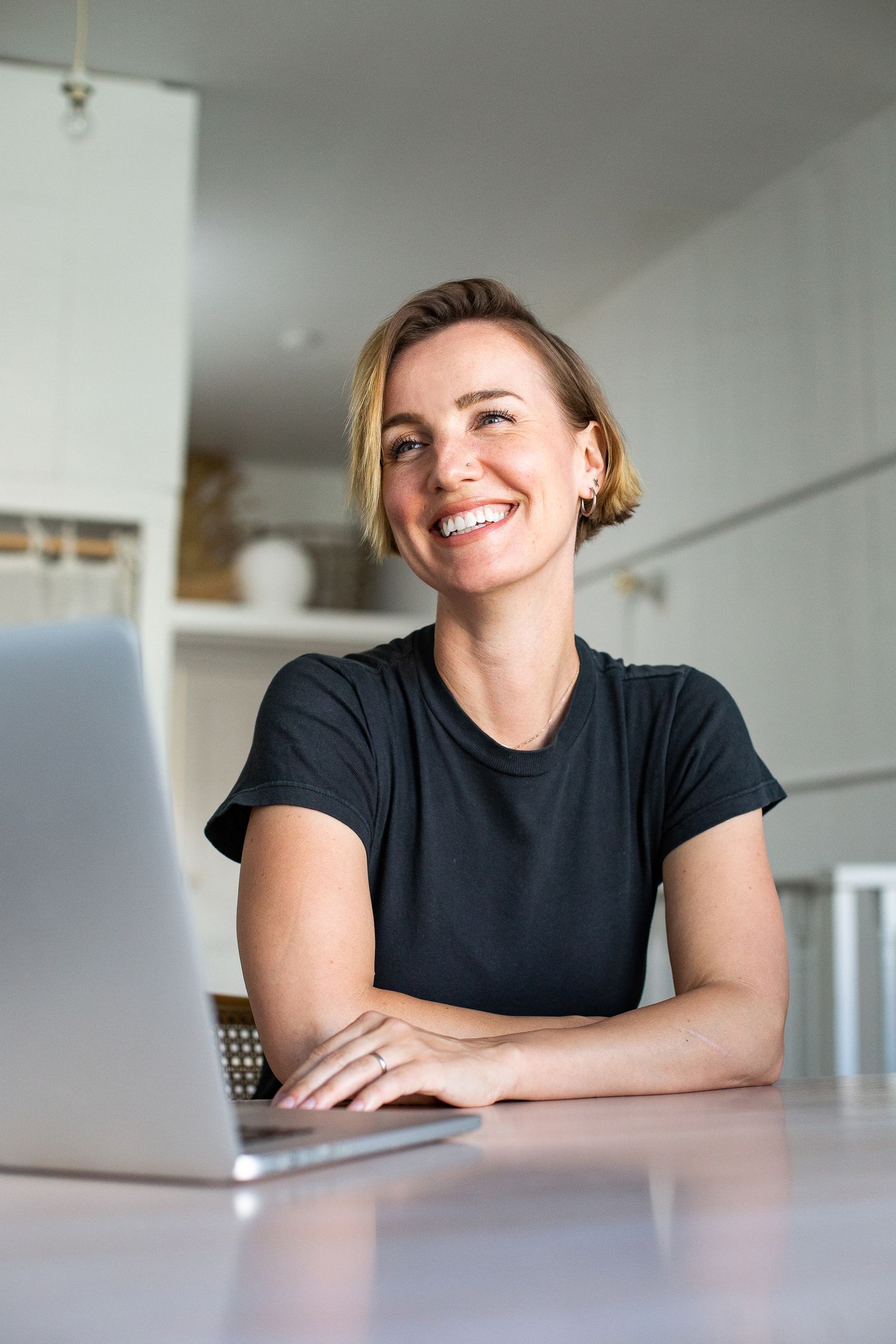 Smiling woman with a laptop