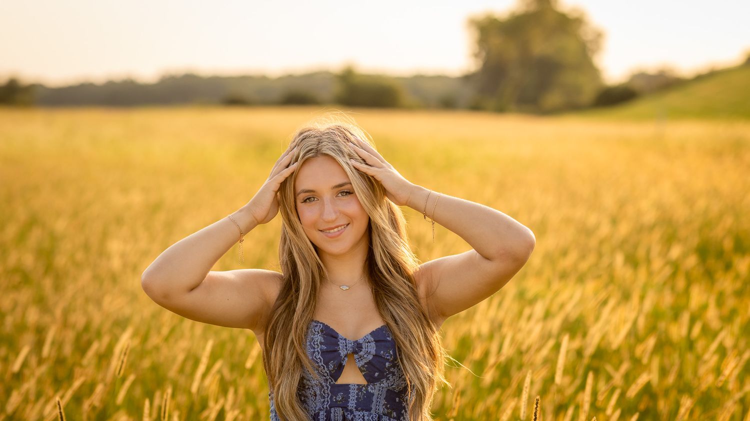 High school senior portrait in a golden field during a Central Illinois senior session