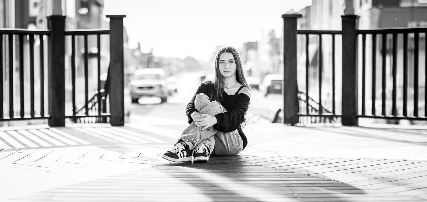 High school senior girl in a gazebo posing outdoors in Carlinville, IL