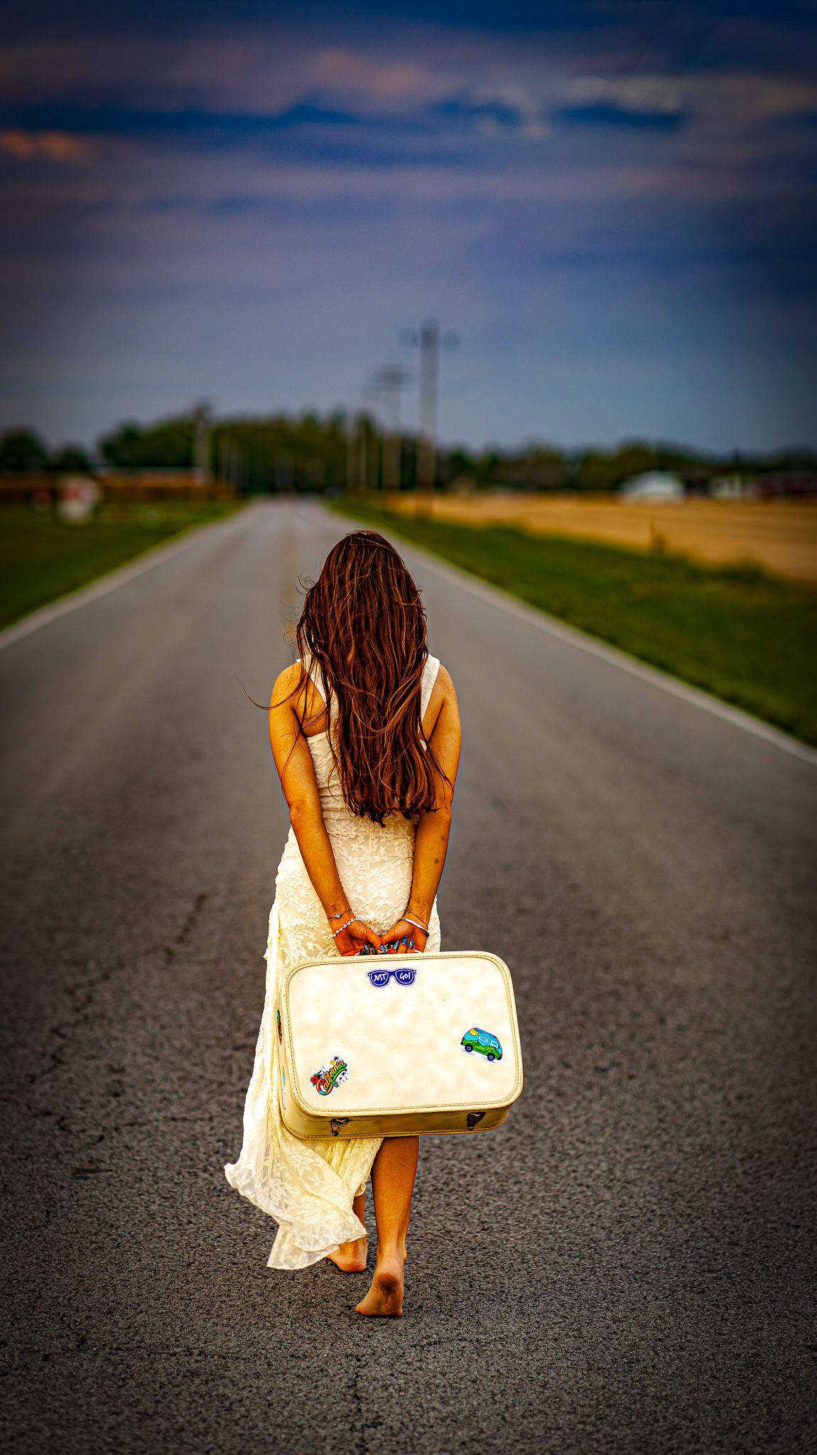 High school senior girl in white dress posing outdoors in Carlinville, IL