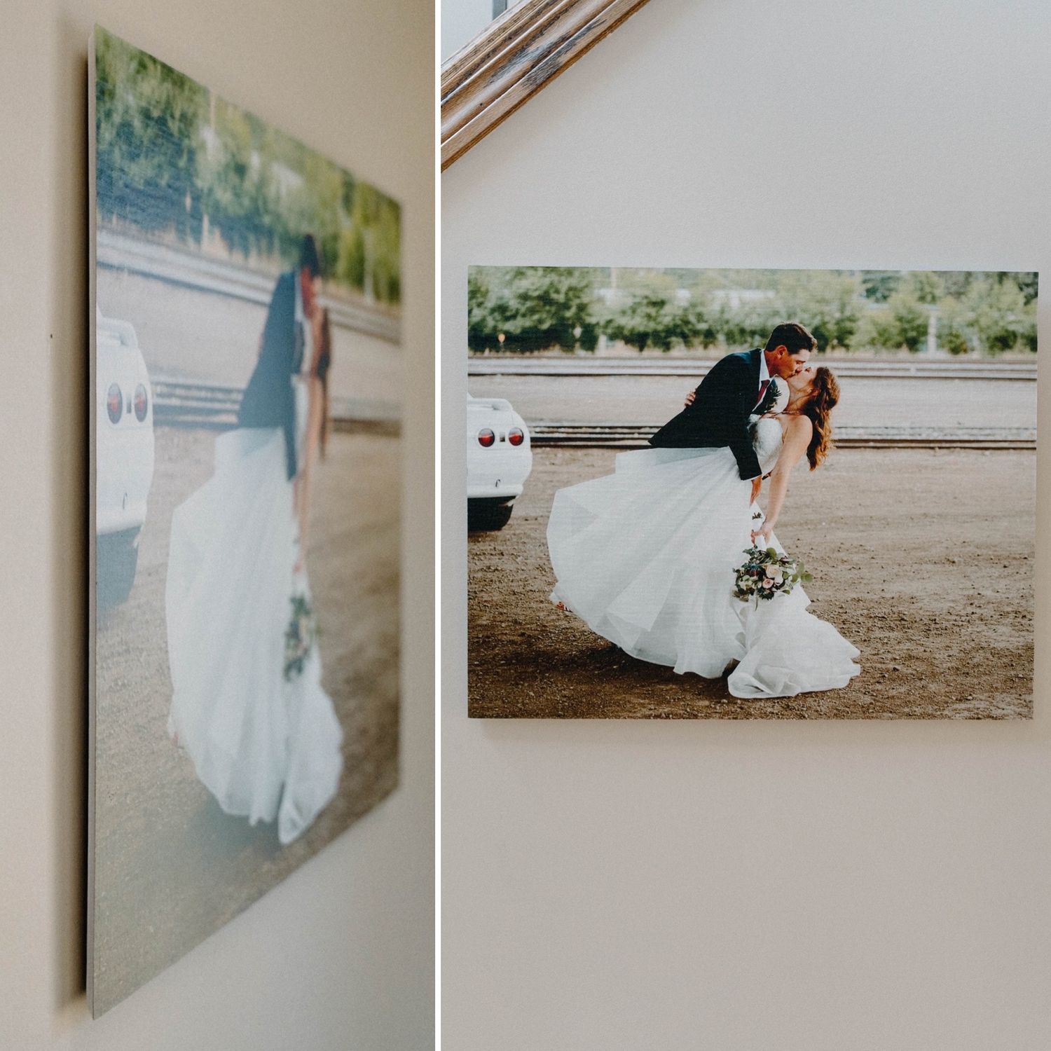 Wedding photo print of couple kissing mounted on wall beside a white car.