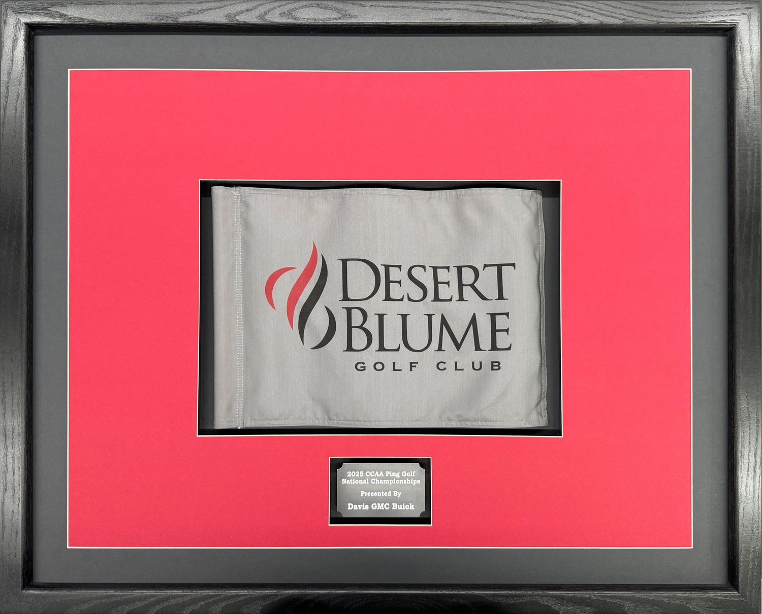Framed Desert Blume Golf Club pin flag mounted on red matting in black frame with engraved nameplate.
