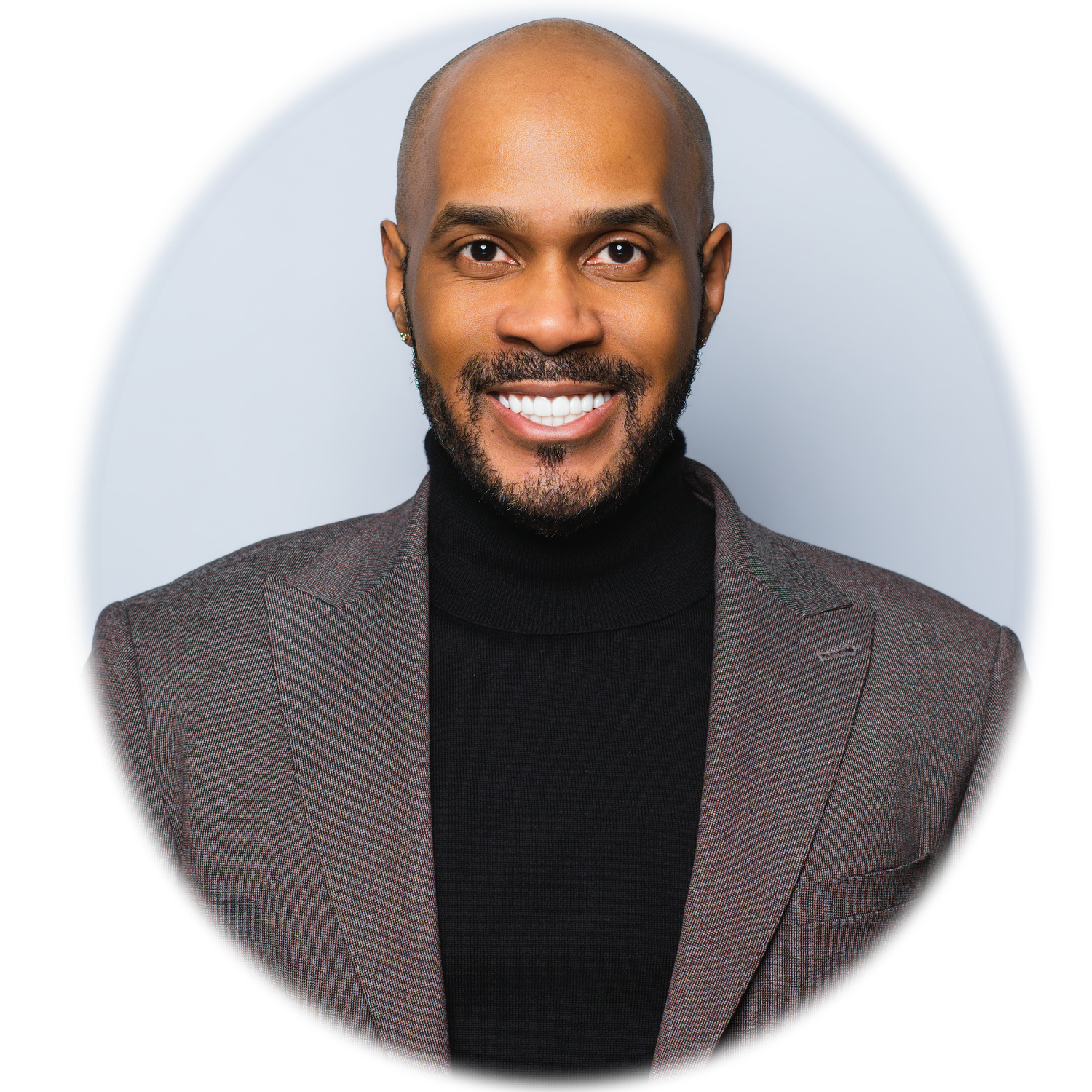 Professional headshot of a bald man with a beard wearing a black turtleneck and gray blazer captured by Atlanta headshot photographer