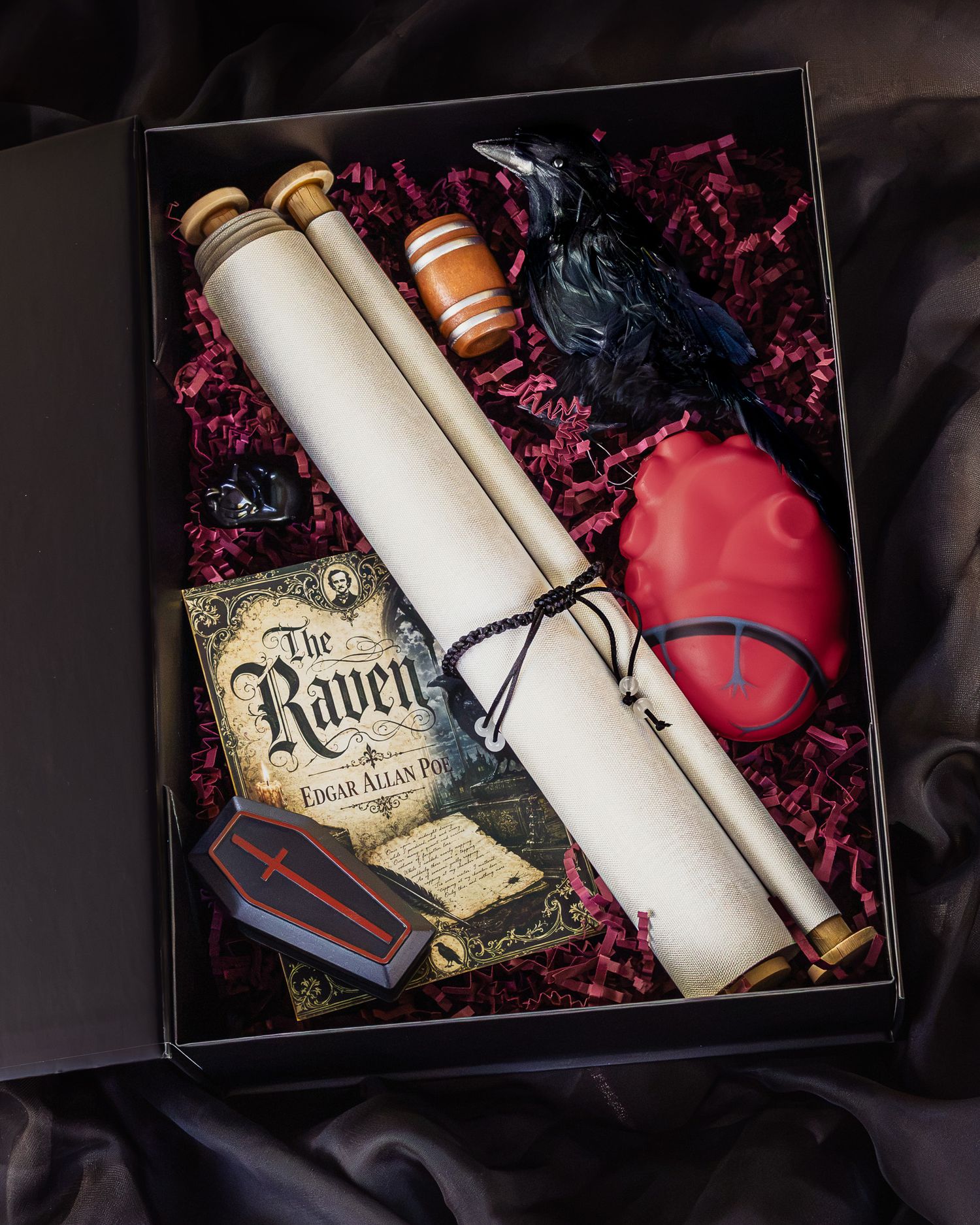 Edgar Allan Poe The Raven gift box with a book, scrolls, black raven figurine, red heart, mini coffin and barrel on crimson shred.