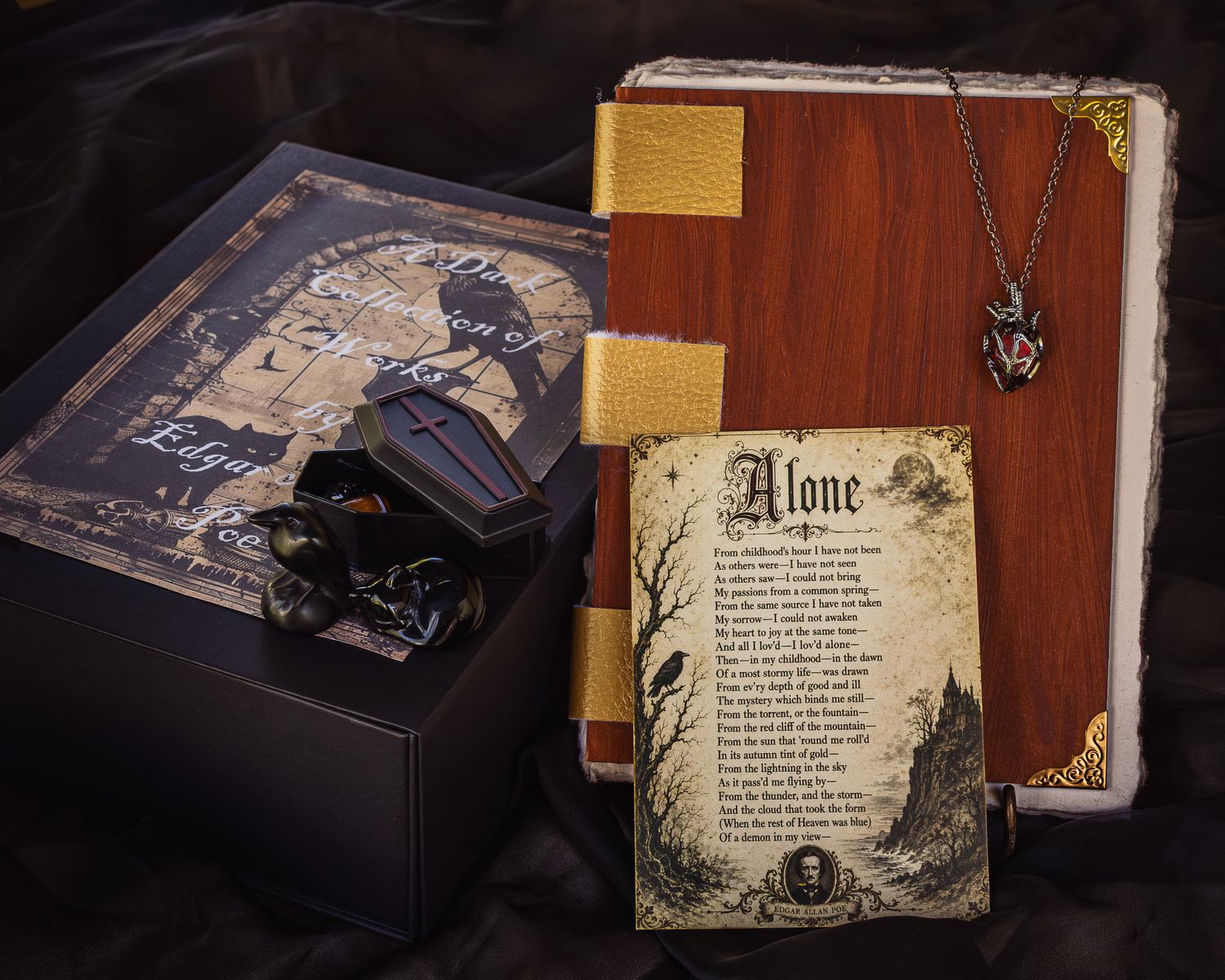Gothic Edgar Allan Poe themed gift set with a black box, miniature coffin, antique-style book and a parchment print of the poem Alone.