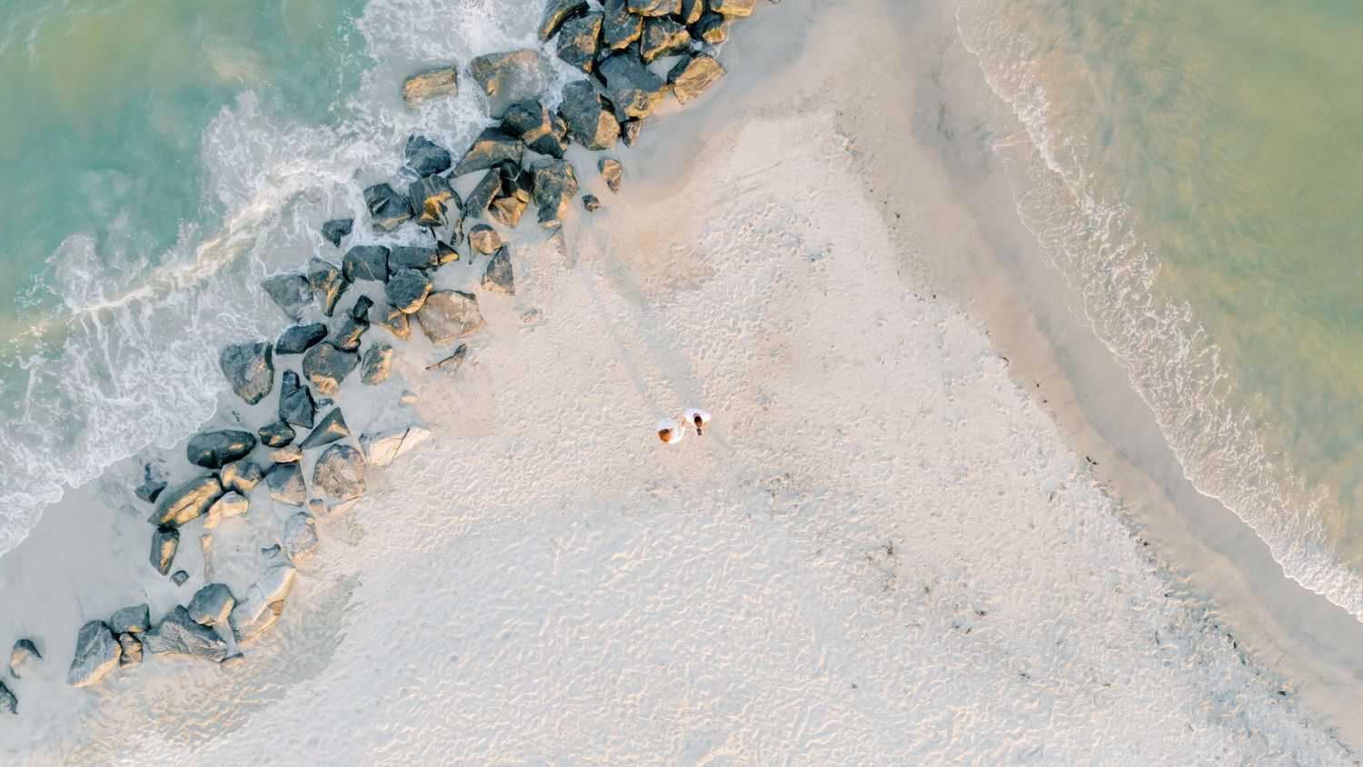 Couples portrait on the beach in Hampton, Virginia at Buckroe Beach.