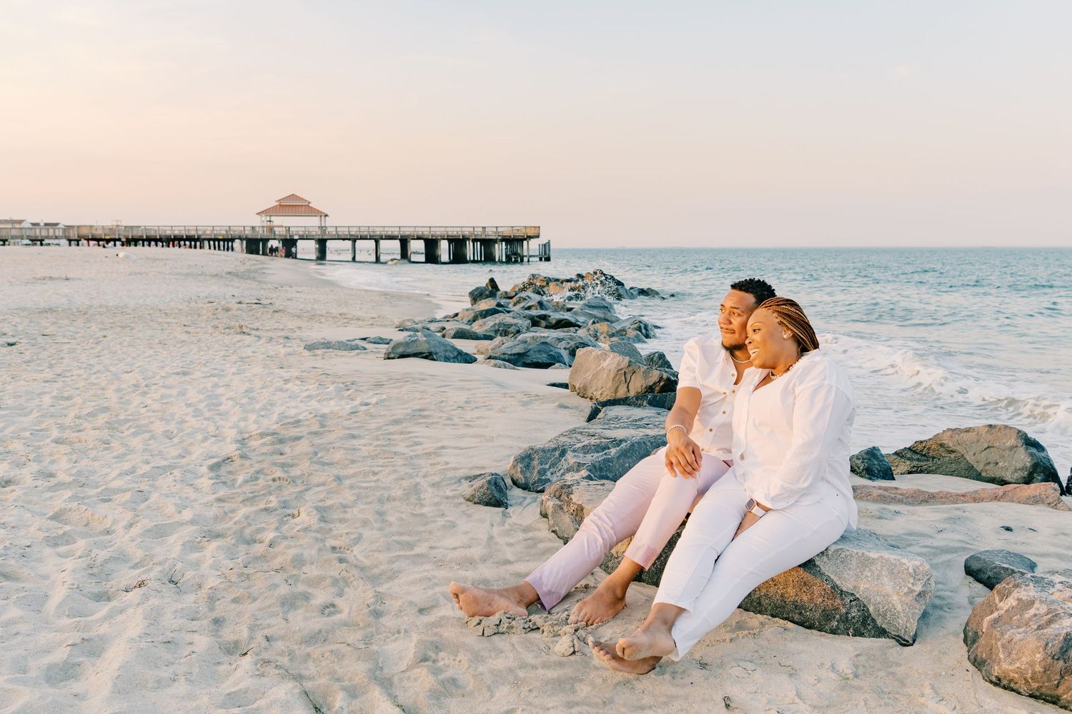 Couples portrait on the beach in Hampton, Virginia at Buckroe Beach.